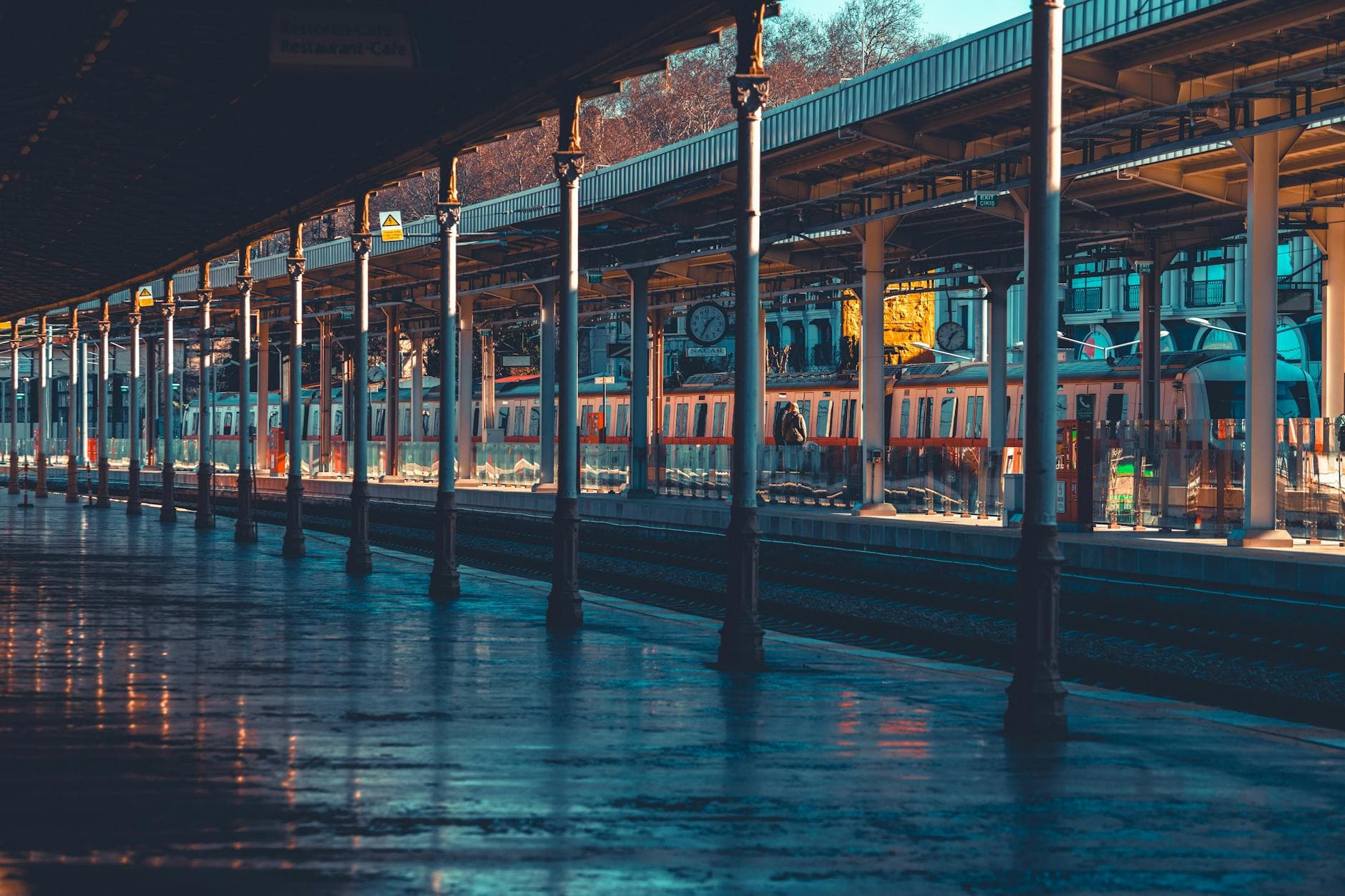 Vibrant daytime view of a tram at Sirkeci Train Station in Istanbul, Türkiye.