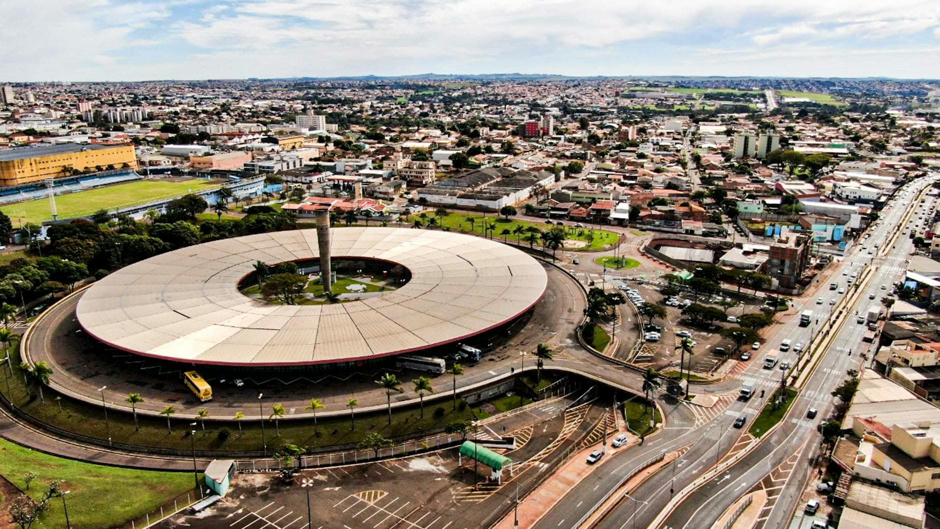 Stunning aerial view of Londrina's iconic circular bus station, capturing urban hustle and intricate road networks.