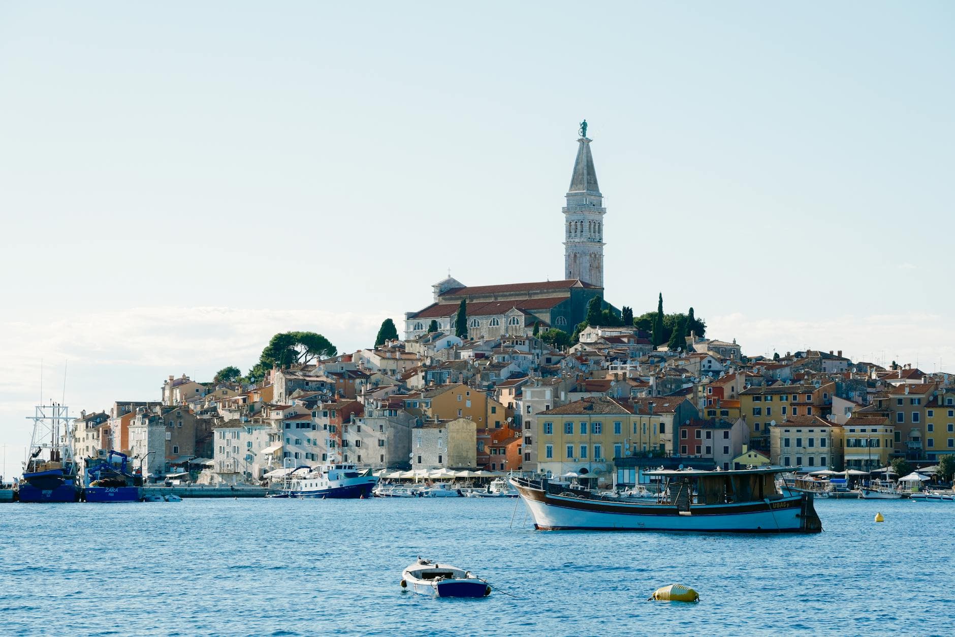Beautiful coastal town of Rovinj, Croatia, showcasing the iconic Saint Euphemia Church and harbor scenery.