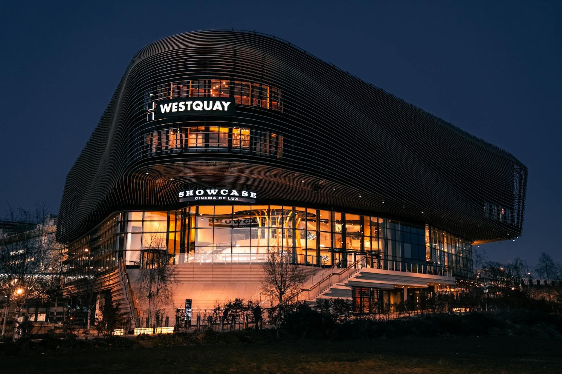 Dramatic night view of Westquay Showcase Cinema in Southampton, UK, beautifully illuminated.