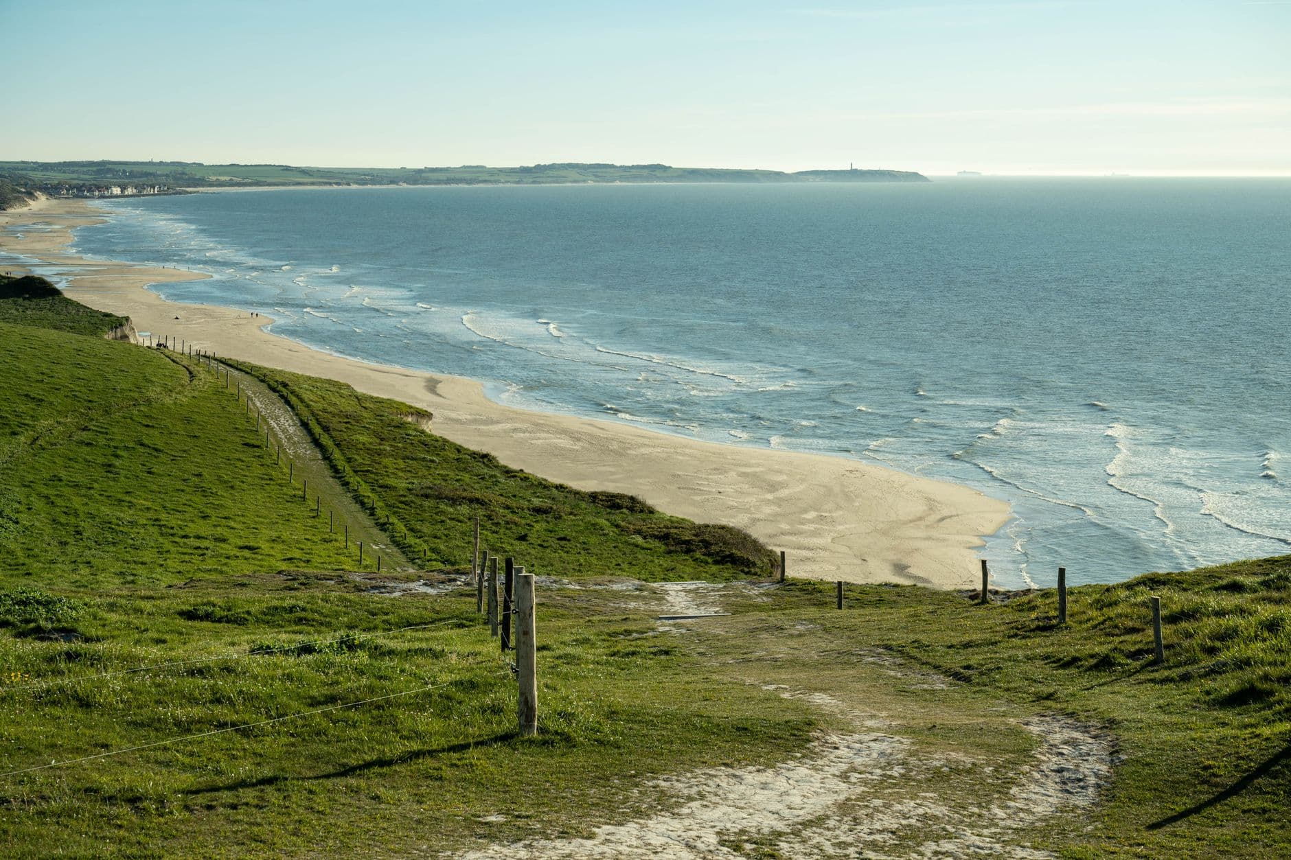 A picturesque coastal landscape in Escalles, capturing the serene beauty of the sea and cliffs.