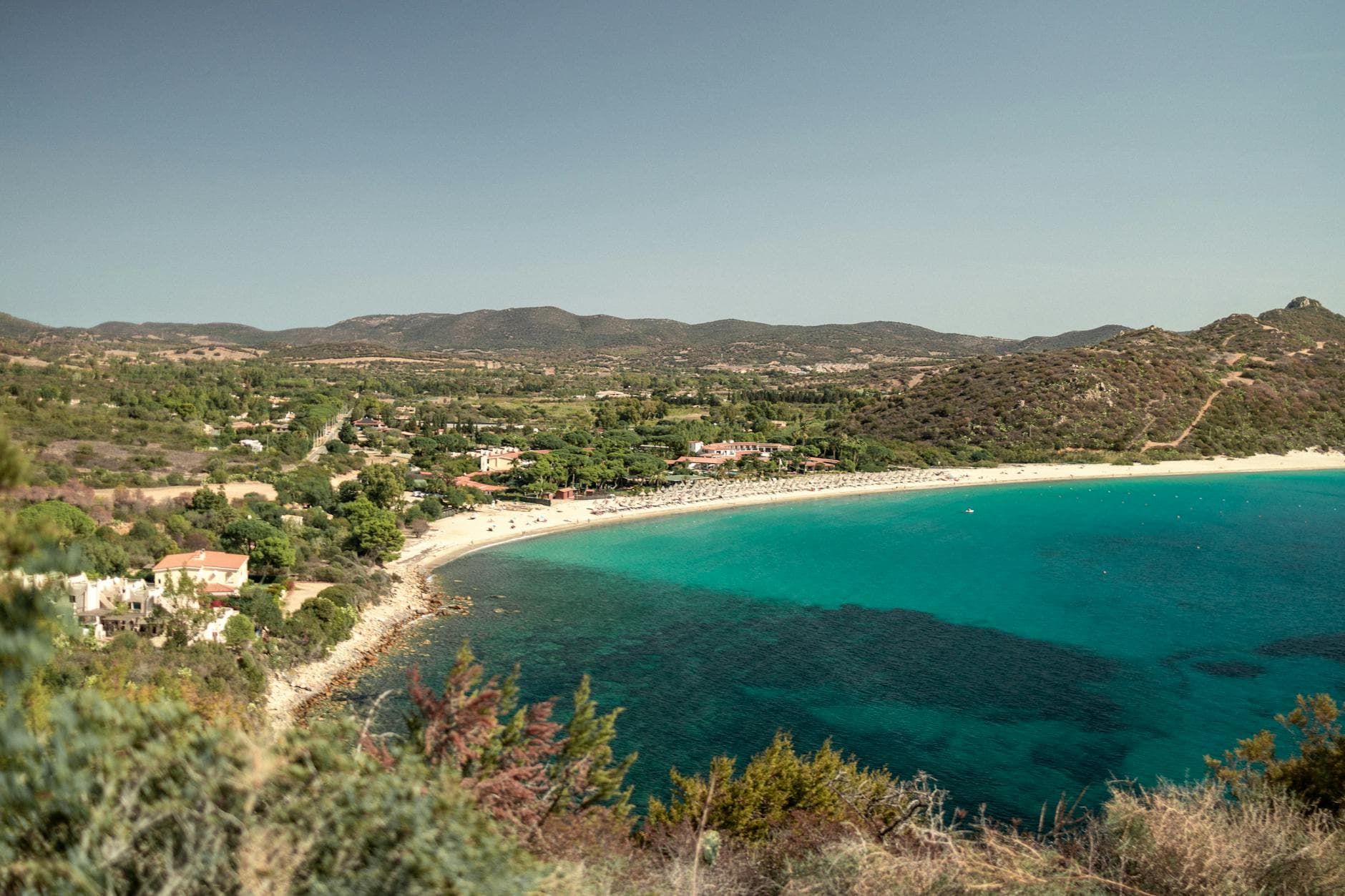 A breathtaking aerial view of the pristine beaches and turquoise waters of Sardinia, Italy.