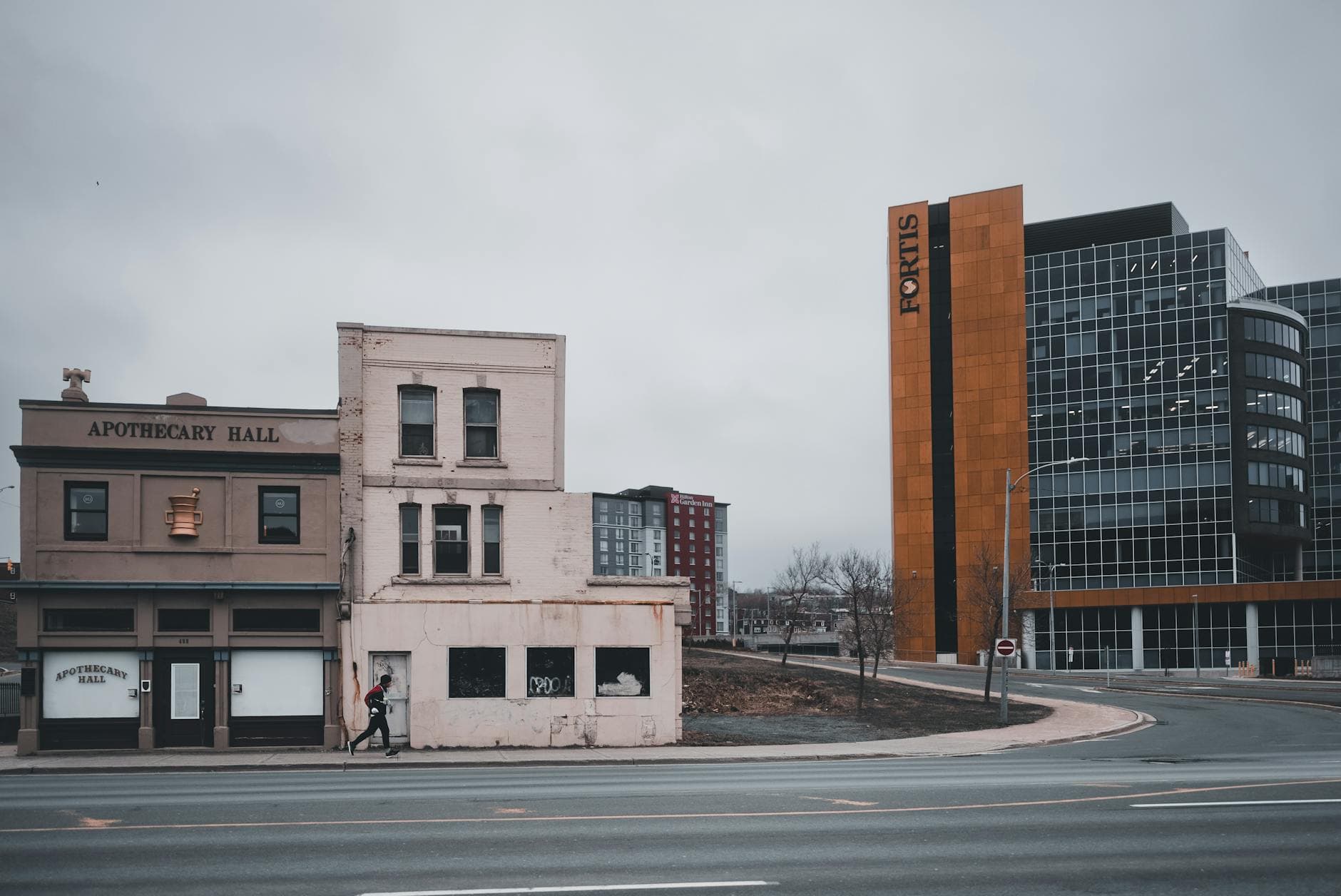 A blend of modern and historic architecture in St John, featuring the iconic Fortis Place and Apothecary Hall.