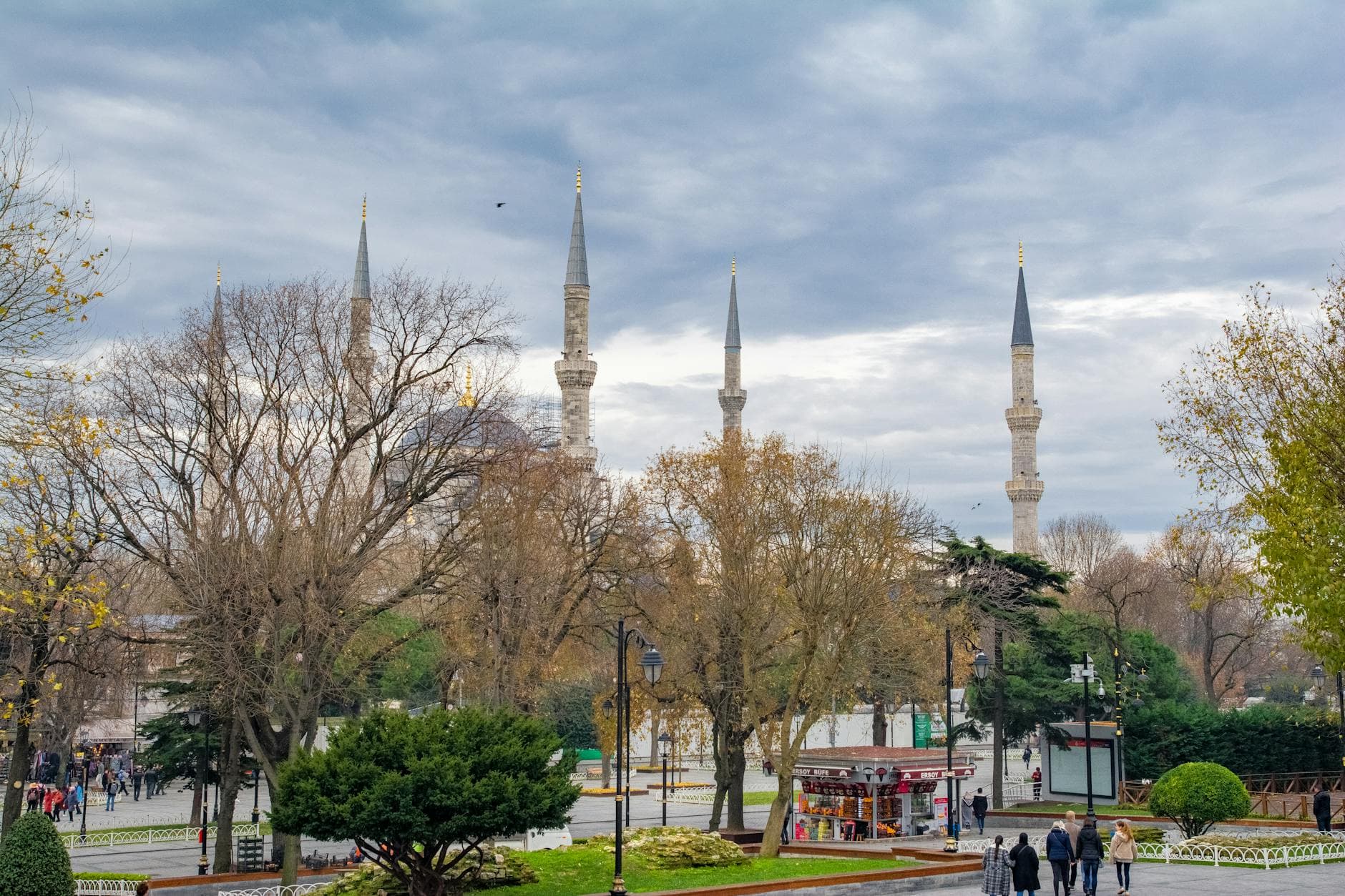 A captivating view of the Sultanahmet Mosque in Istanbul with towering minarets and an overcast sky.