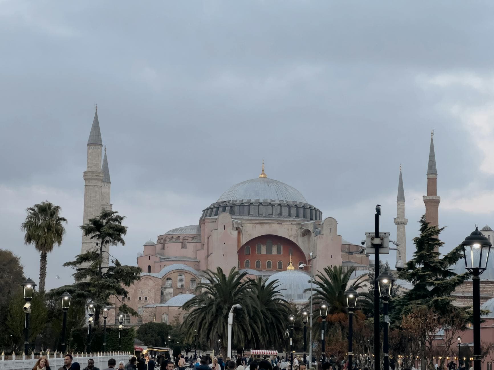 View of the Hagia Sophia with its minarets surrounded by palm trees in Sultanahmet Square, Istanbul.