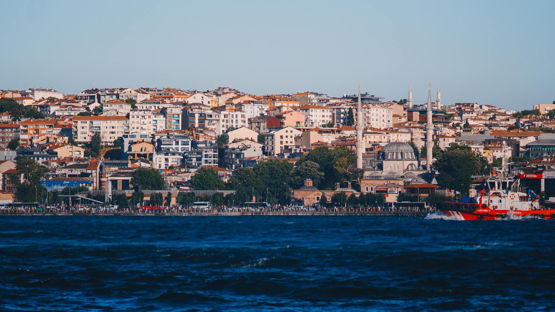 Beautiful cityscape of Istanbul's waterfront with historic architecture and vibrant urban life.