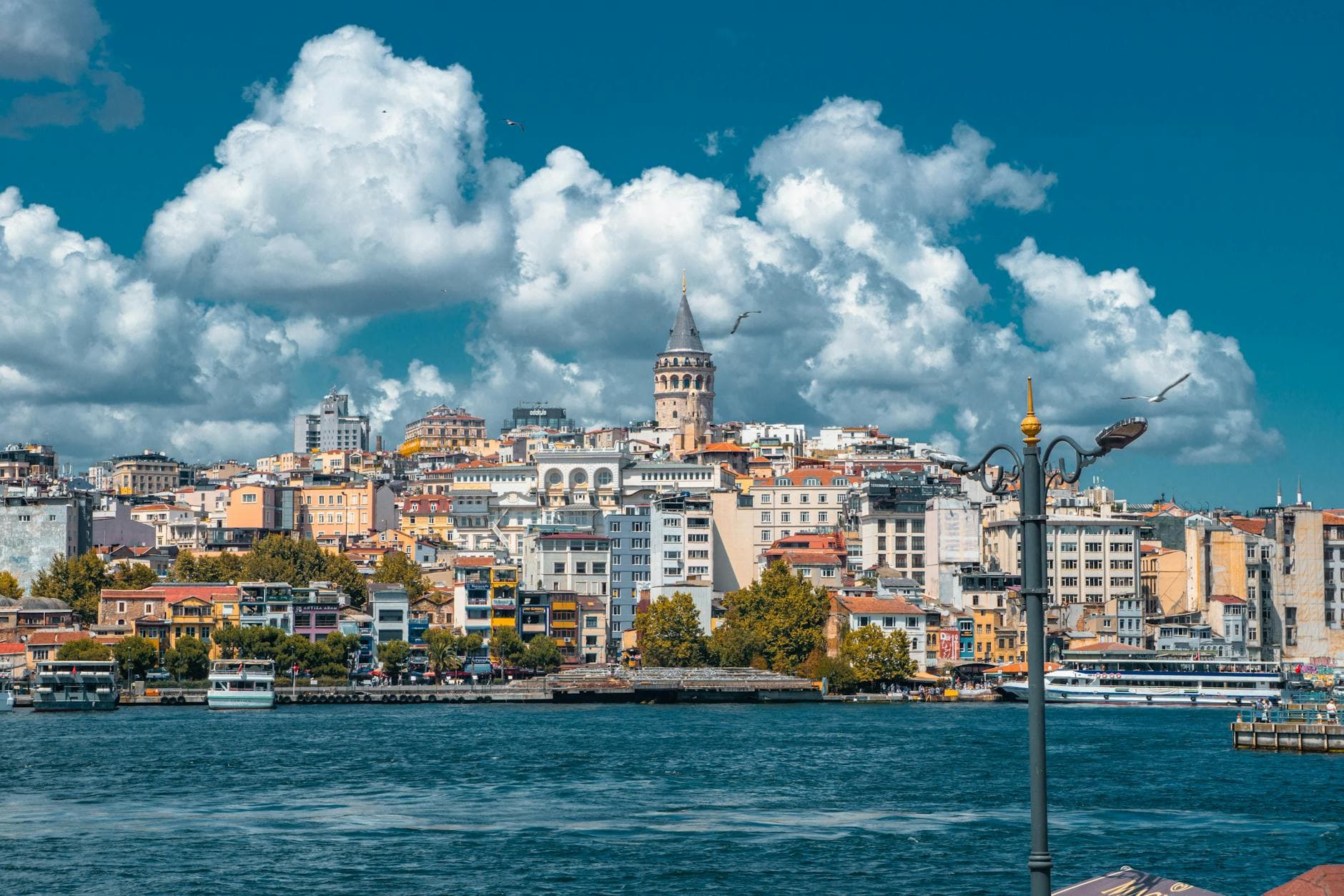 Beautiful skyline featuring Galata Tower and vibrant waterfront in Istanbul, ideal for travel and architecture themes.