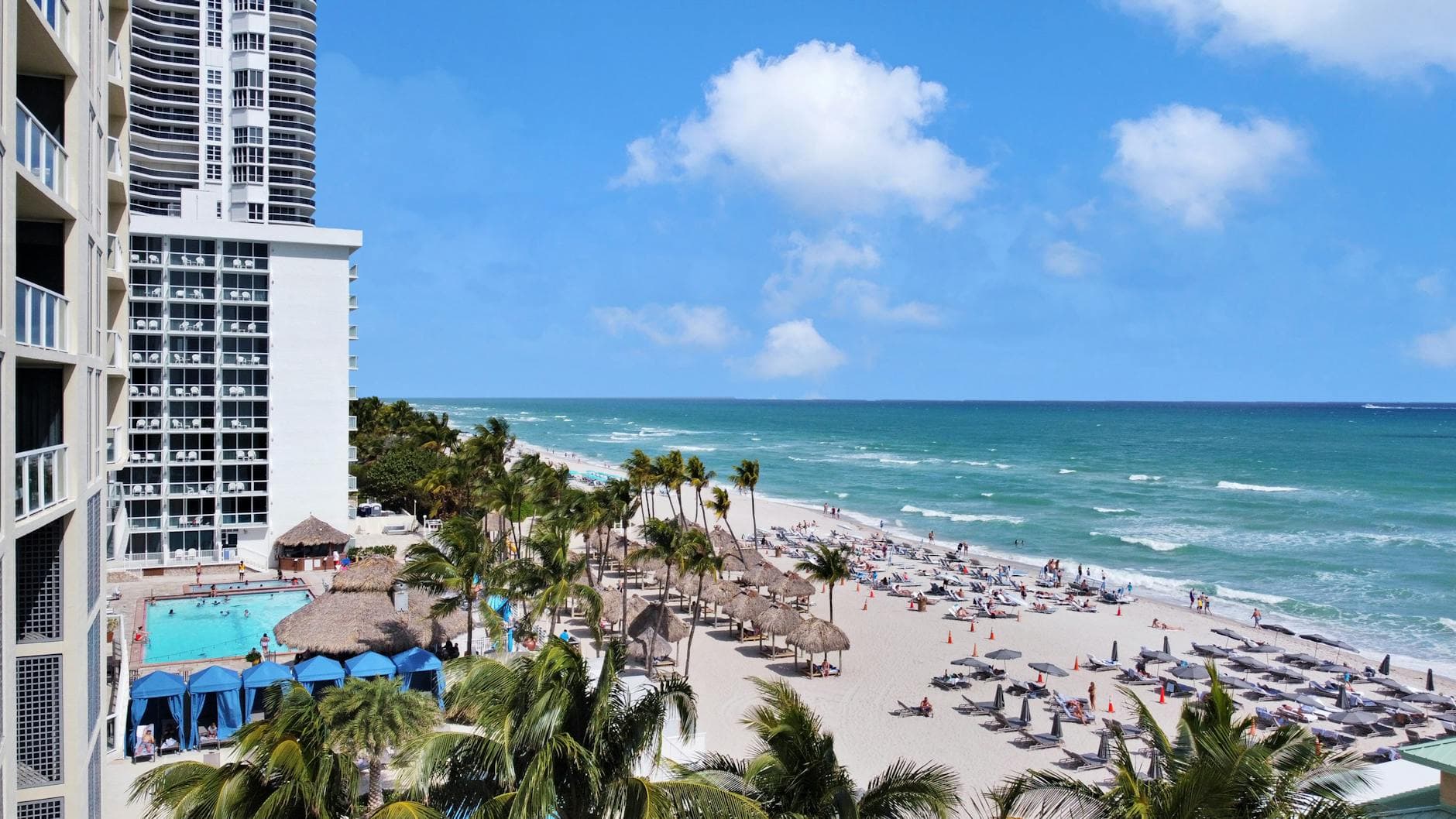 Experience the luxury of Sunny Isles Beach with ocean views, palm trees, and resort amenities.
