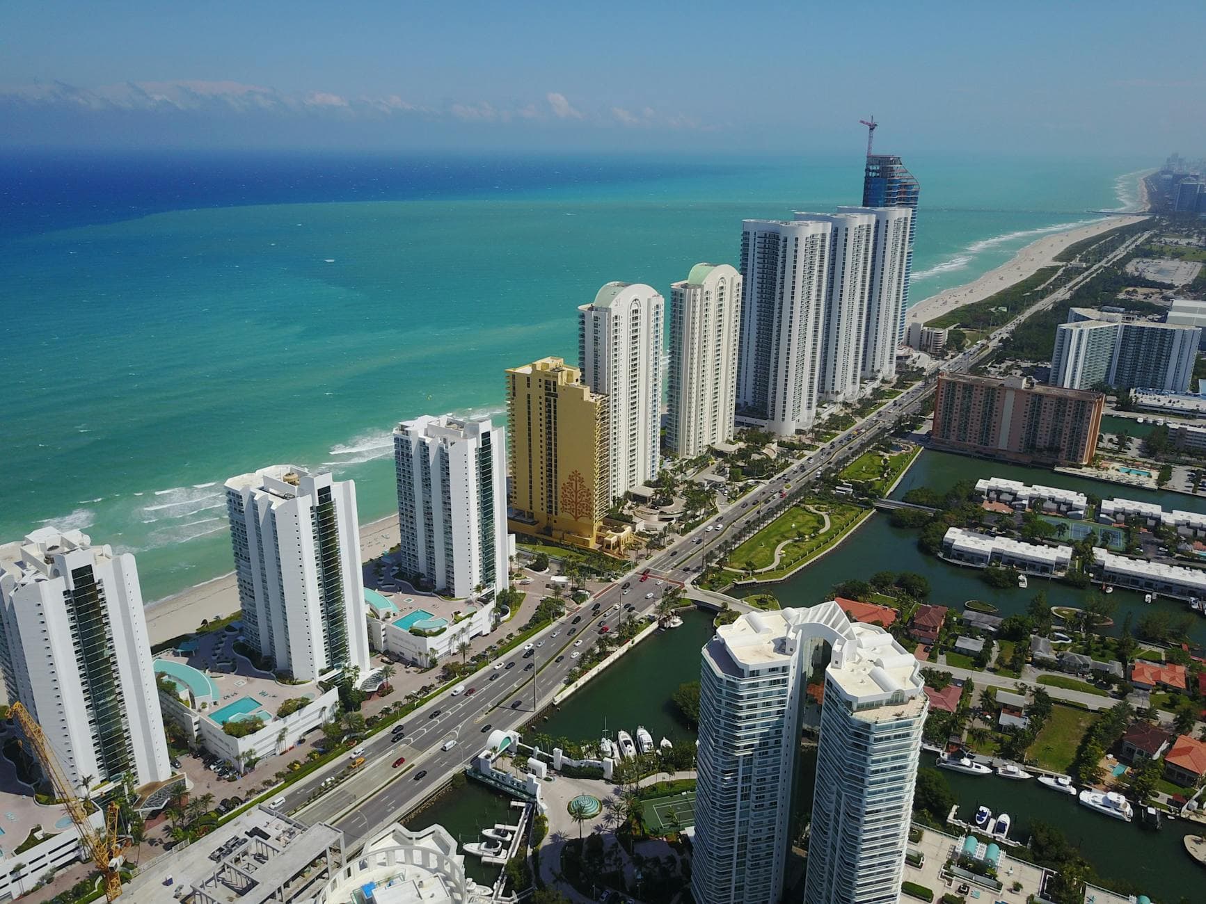 Stunning aerial panorama of Sunny Isles Beach's modern skyscrapers along the coastline.