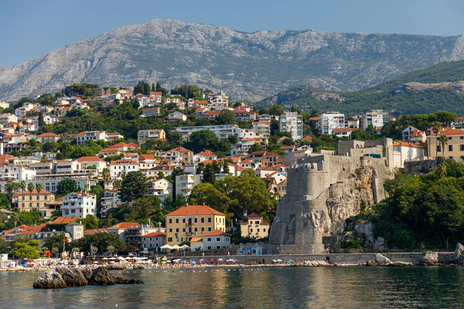Beautiful landscape of Herceg Novi with historic fortress and coastal mountain backdrop in Montenegro