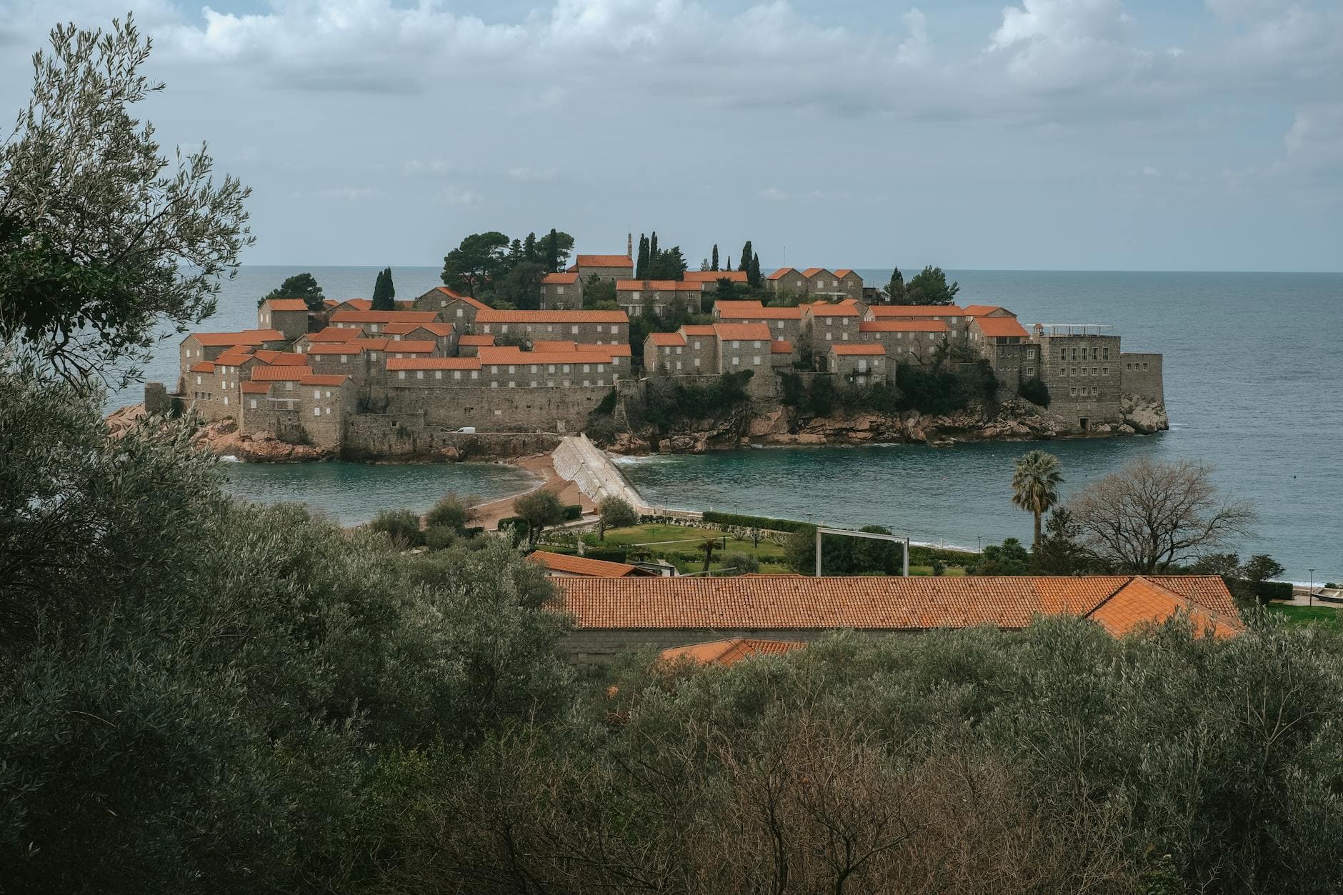 Beautiful view of Sveti Stefan, a renowned island resort with historic architecture in Montenegro.