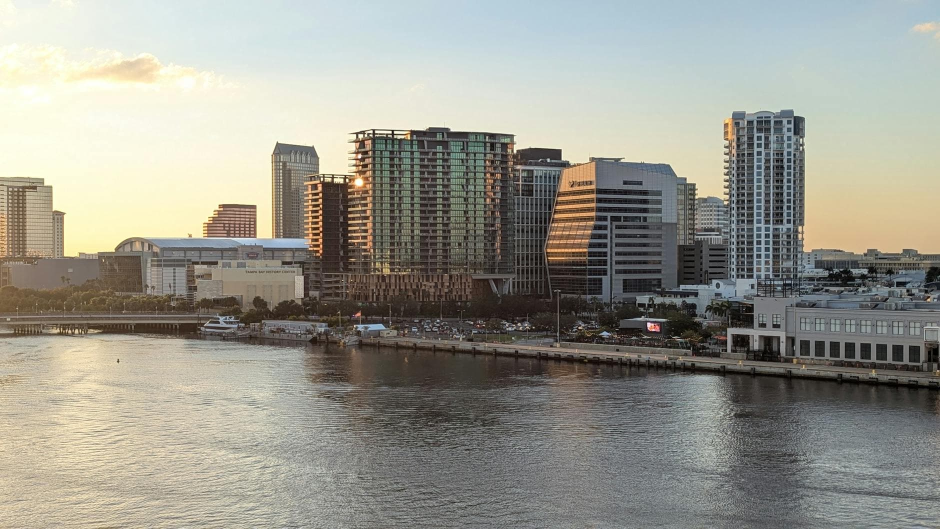 A stunning view of Tampa's skyline reflecting on the water at sunset.
