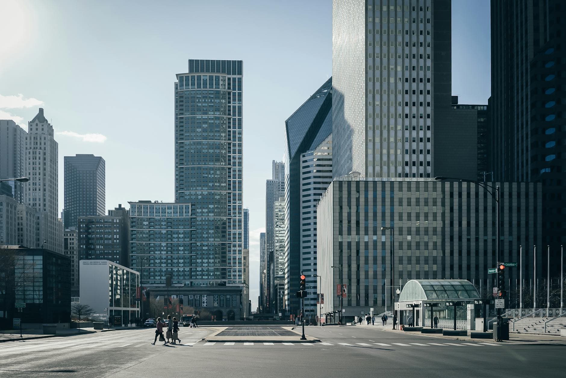 Urban cityscape of Chicago with towering skyscrapers and a calm street view.
