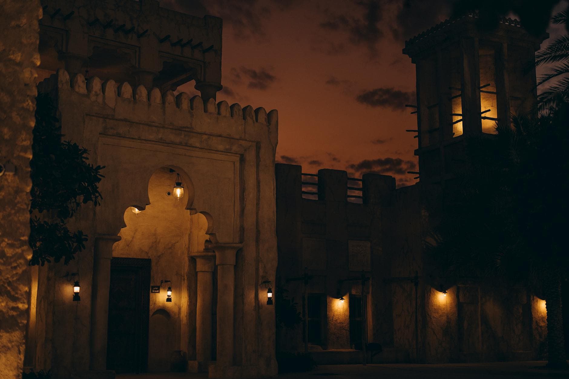 Stunning nighttime view of Al Shindagha's traditional architecture in Dubai, UAE. Warm lighting enhances historic charm.