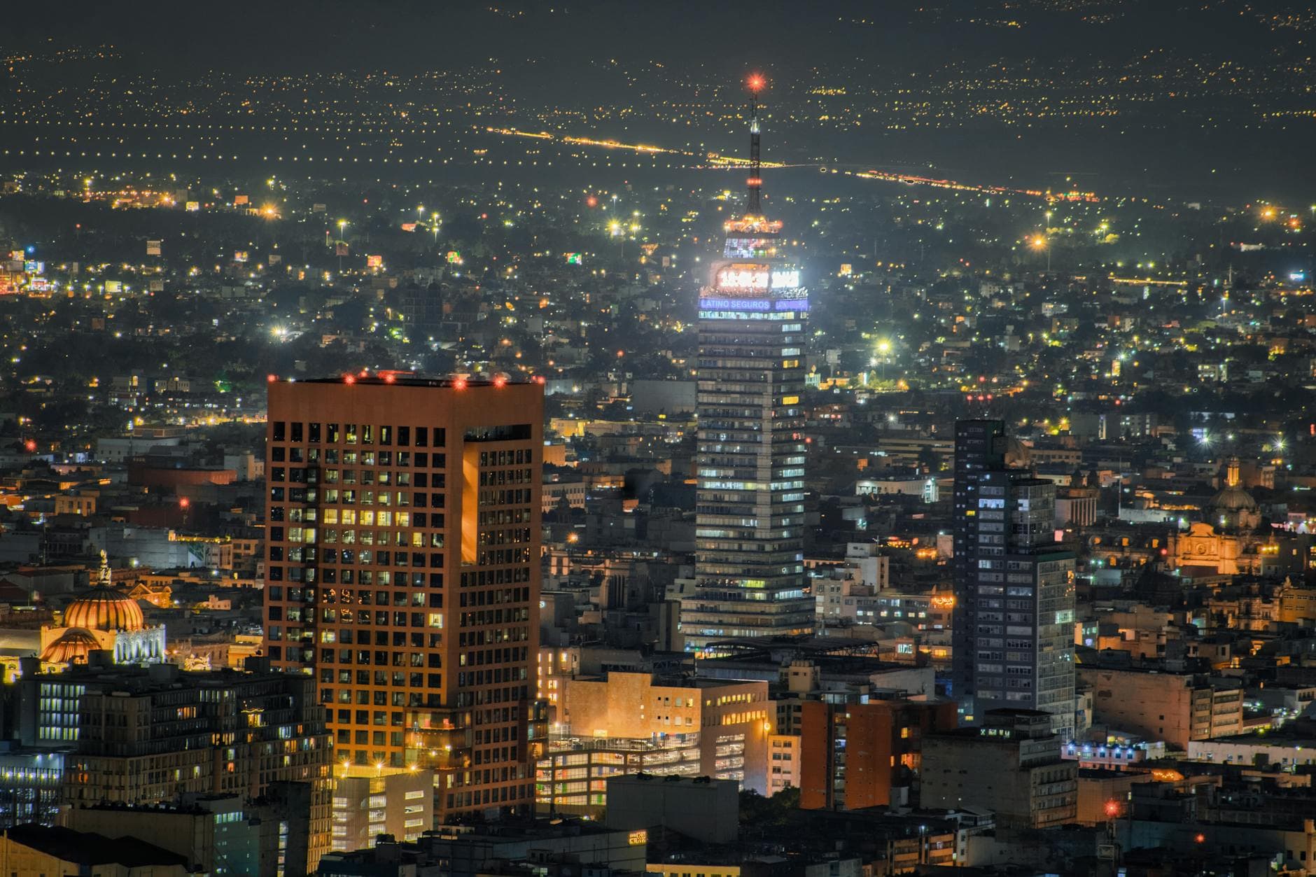 Stunning nighttime view of Mexico City's skyline featuring Torre Latinoamericana.