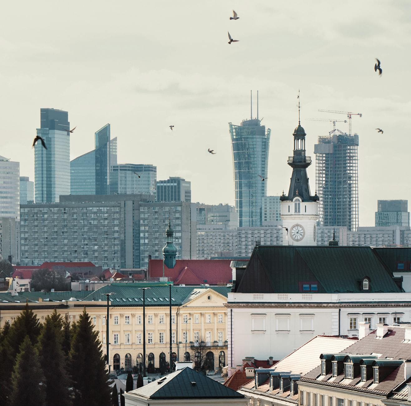 A blend of modern skyscrapers and historical buildings in Warsaw, Poland.