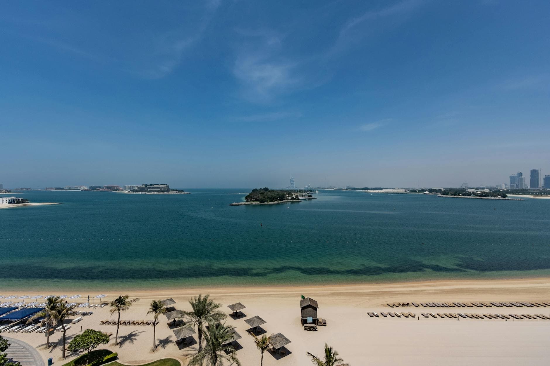 Explore the serene beaches and skyline view of Palm Jumeirah in Dubai, UAE.