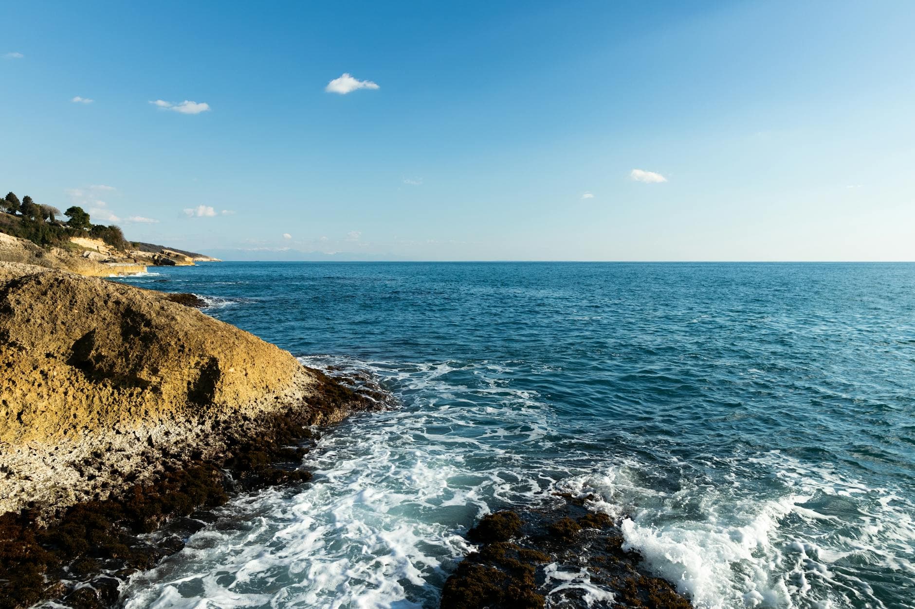 Stunning view of the rocky coastline and clear blue waters in Ulcinj, Montenegro.