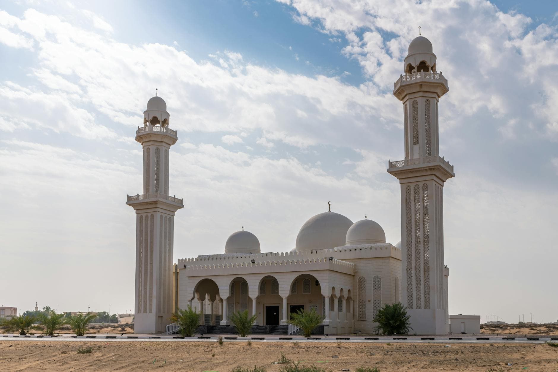Stunning view of a mosque with domes and minarets in Umm Al Quwain, United Arab Emirates.