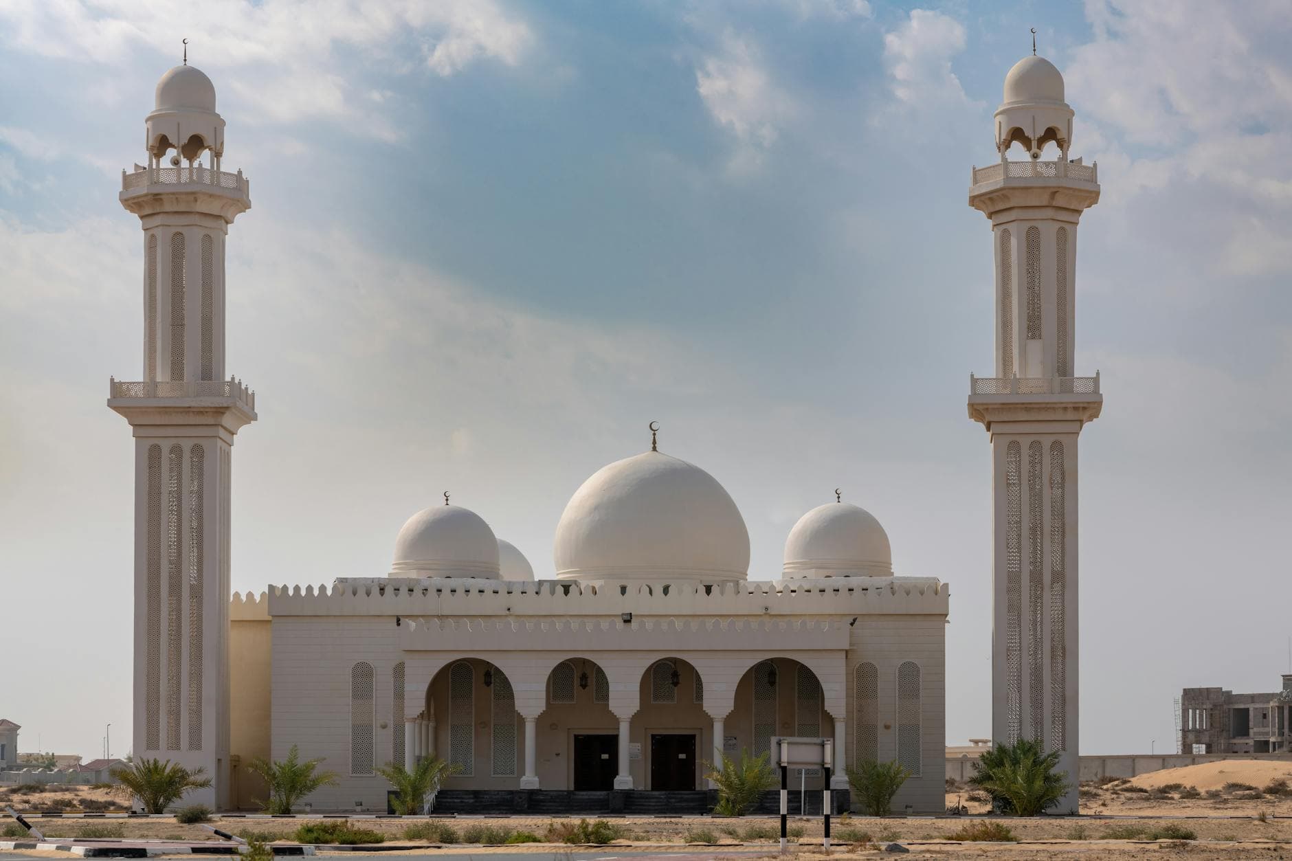 Beautiful mosque exterior in Umm Al Quwain, UAE, showcasing Islamic architecture.