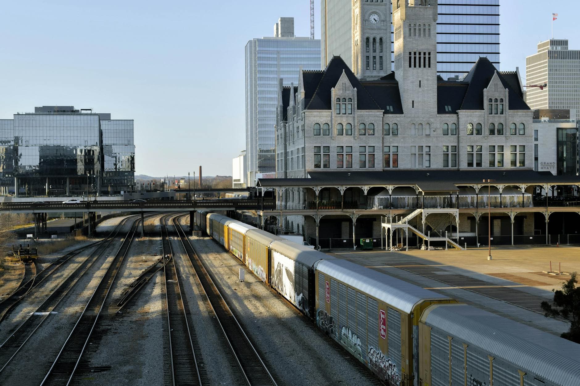 View of Union Station and railway tracks in Nashville, Tennessee, during the day with modern buildings.