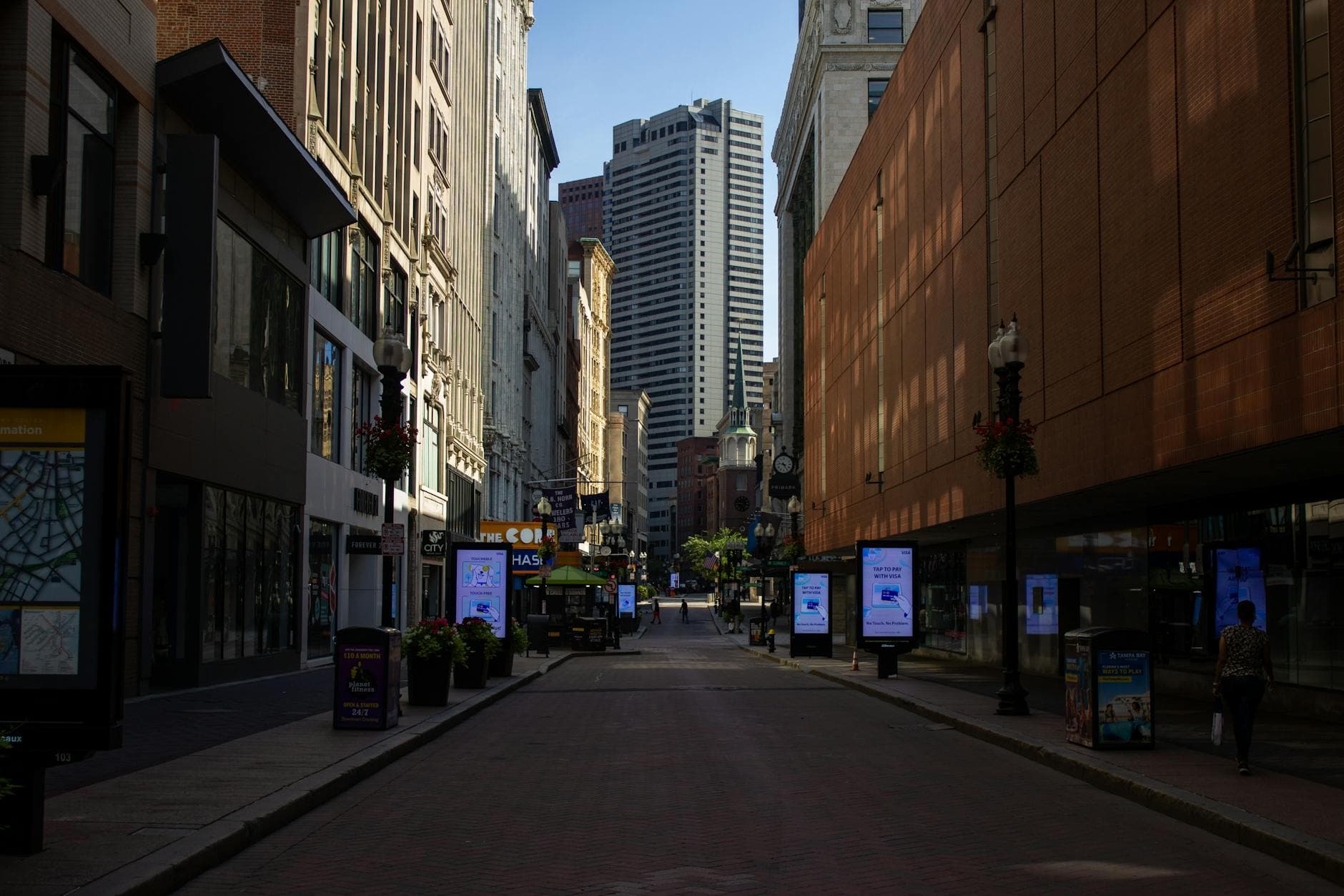 Explore the quiet cityscape of Boston's historic downtown with its towering buildings and empty streets.