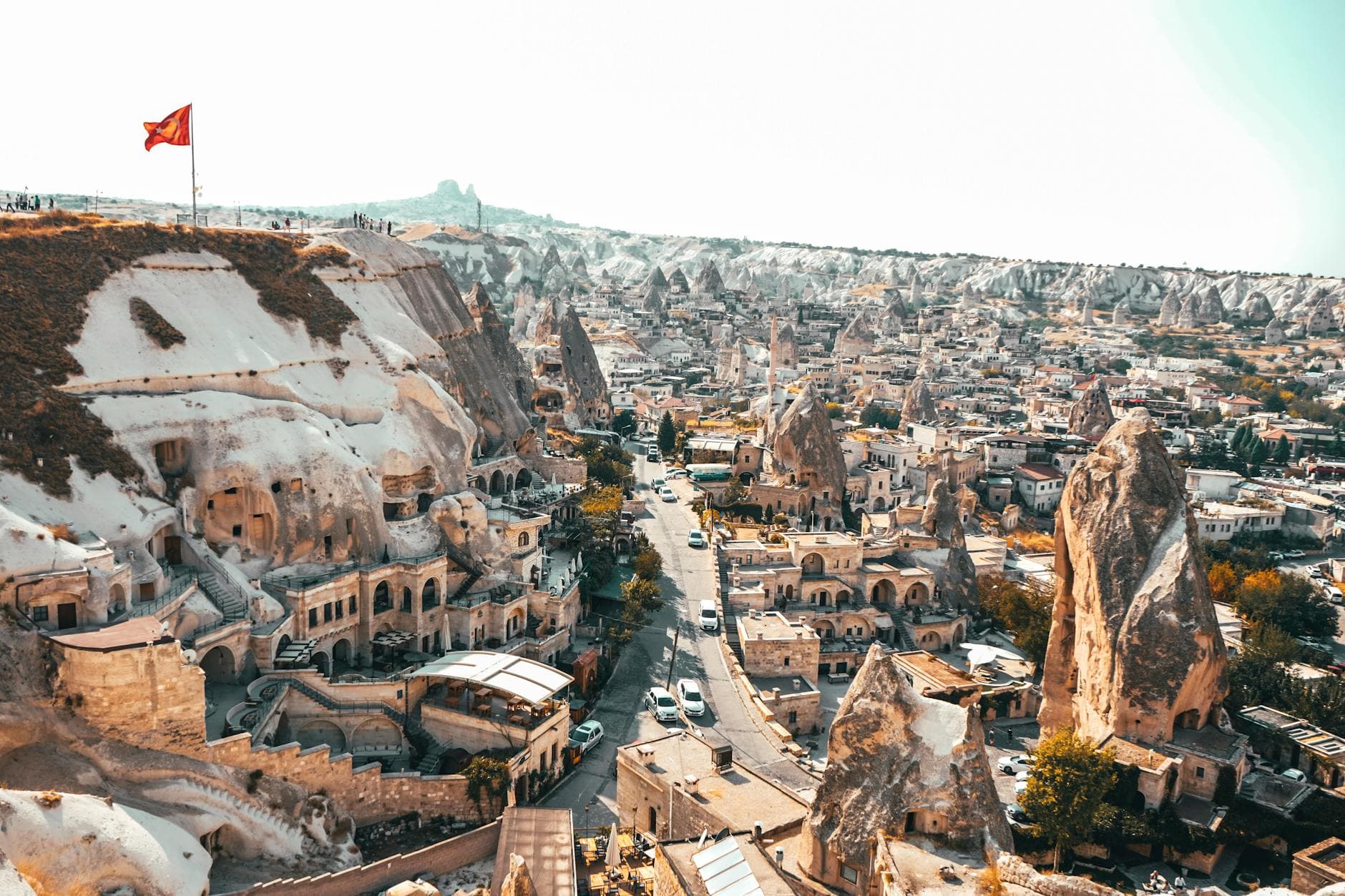 Breathtaking aerial view of Ürgüp's unique rock formations in Cappadocia, highlighting its ancient architecture.