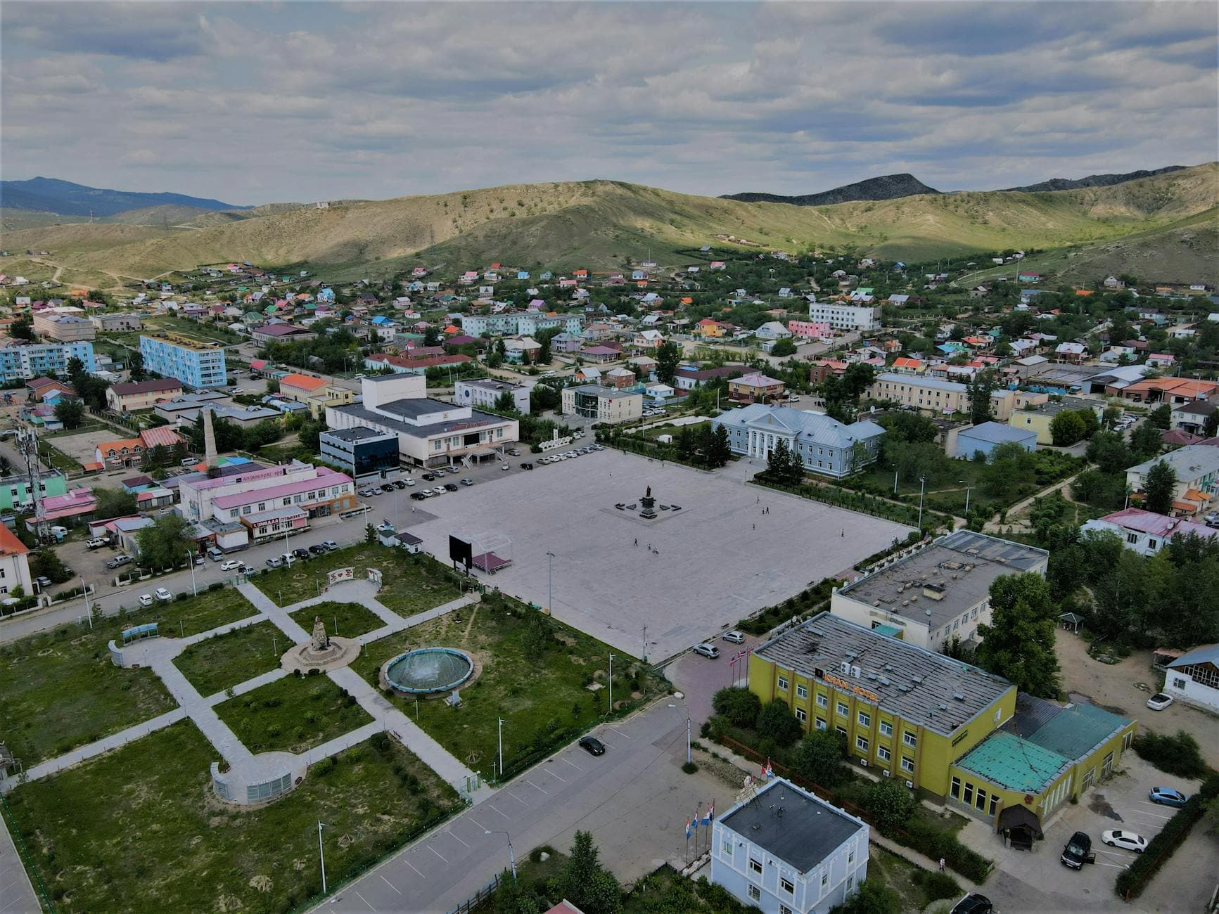 Aerial view of Sukhbaatar townscape in Selenge, Mongolia, showcasing urban layout with surrounding hills.