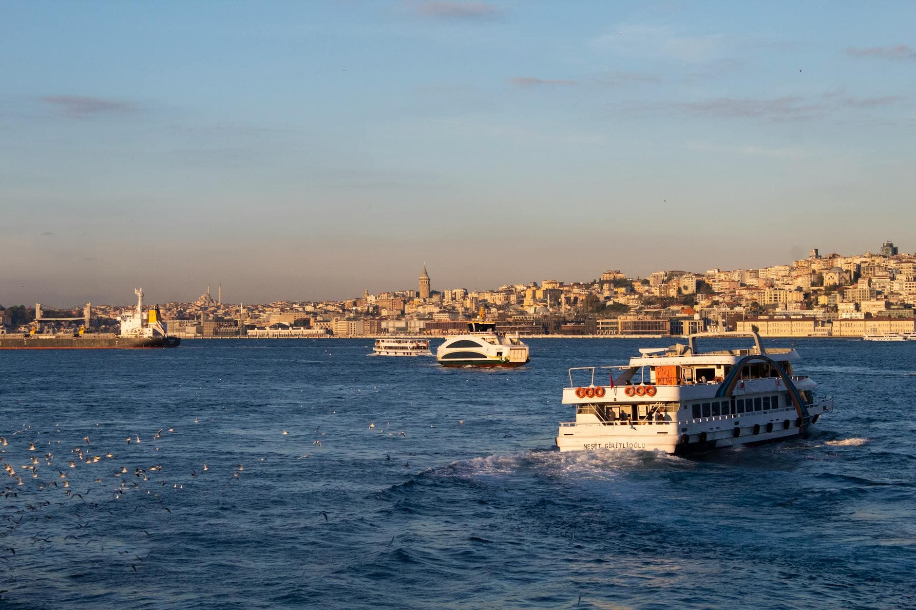 Experience the bustling Bosphorus with ferries against Istanbul's charming skyline from Üsküdar.