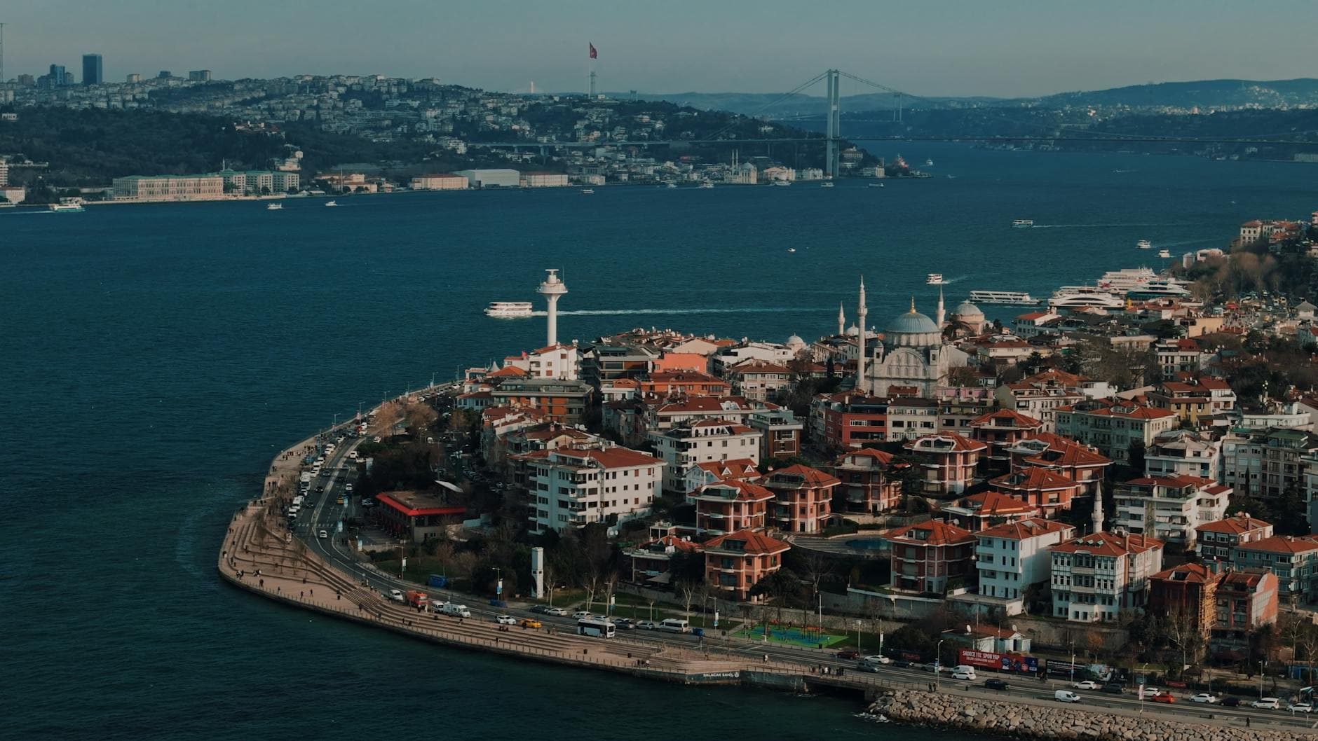 A stunning aerial view of Üsküdar with the Bosphorus Bridge in the background on a clear day.