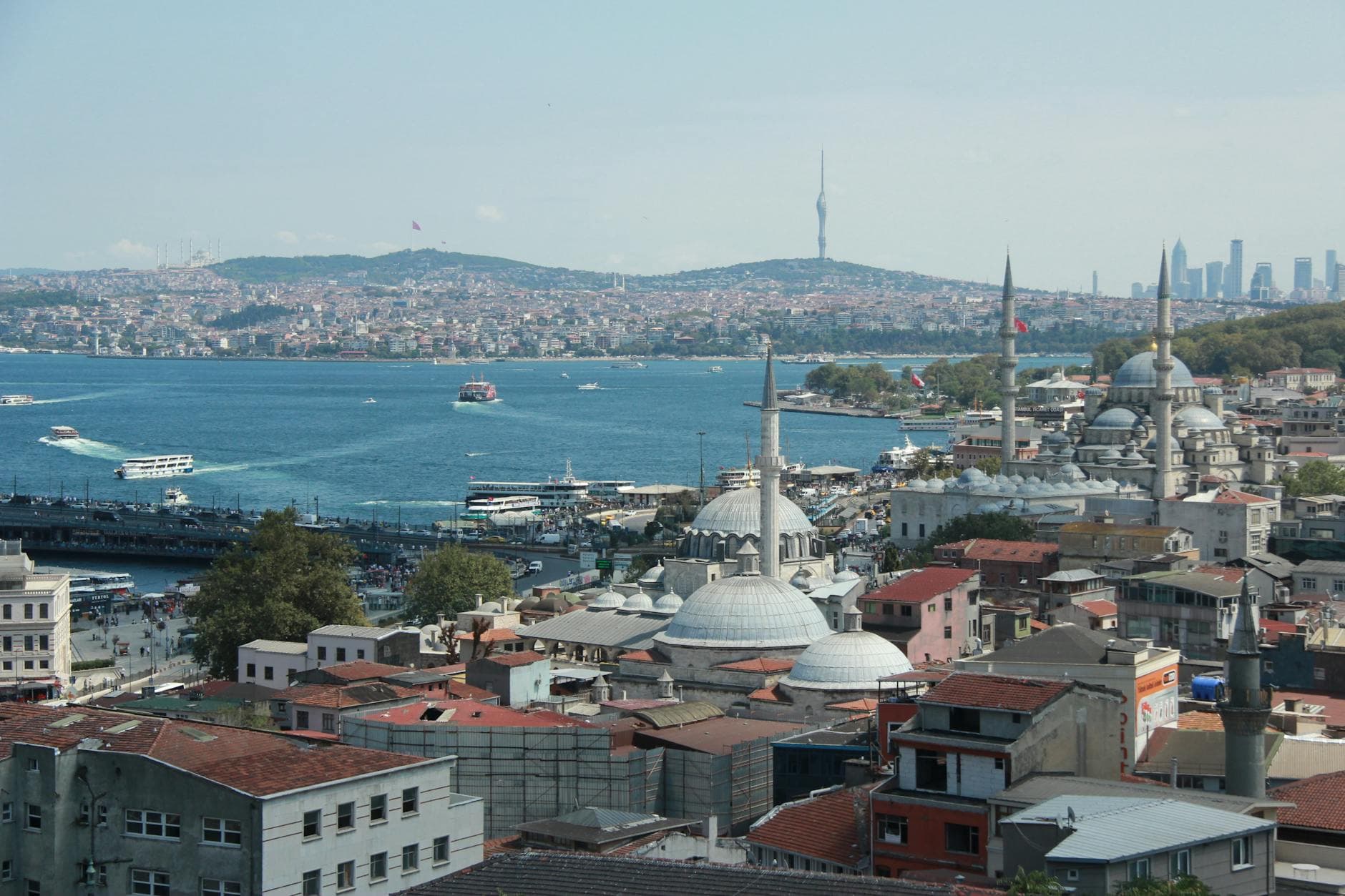 A stunning aerial view of Istanbul's skyline featuring historic mosques and the Bosphorus Strait.