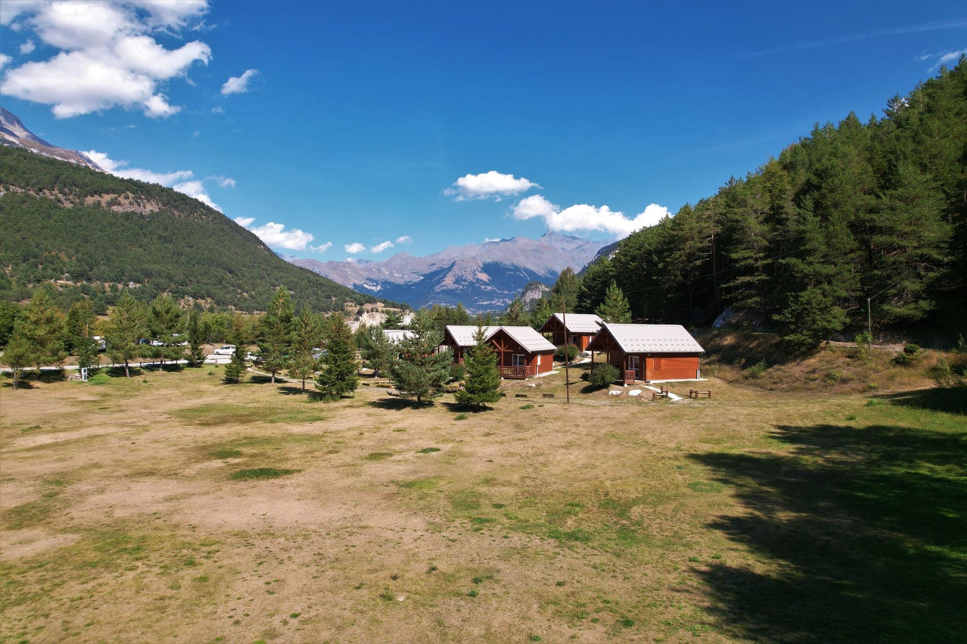 Scenic view of mountain chalets in Val-Cenis, showcasing a peaceful alpine landscape.