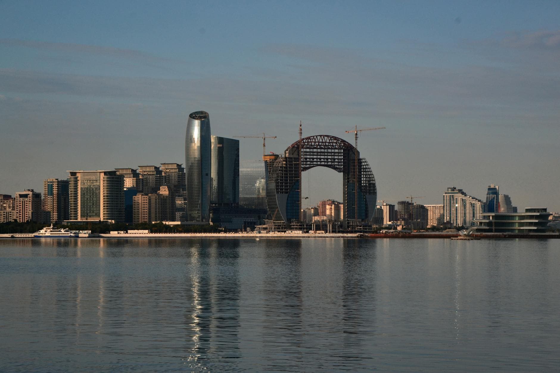 Stunning Baku skyline showcasing modern architecture along the waterfront under a clear sky.