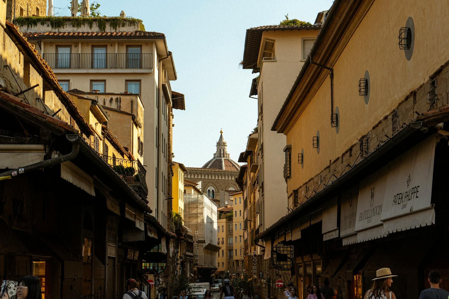 Charming street view of Florence featuring the iconic Duomo dome in Tuscany, Italy.