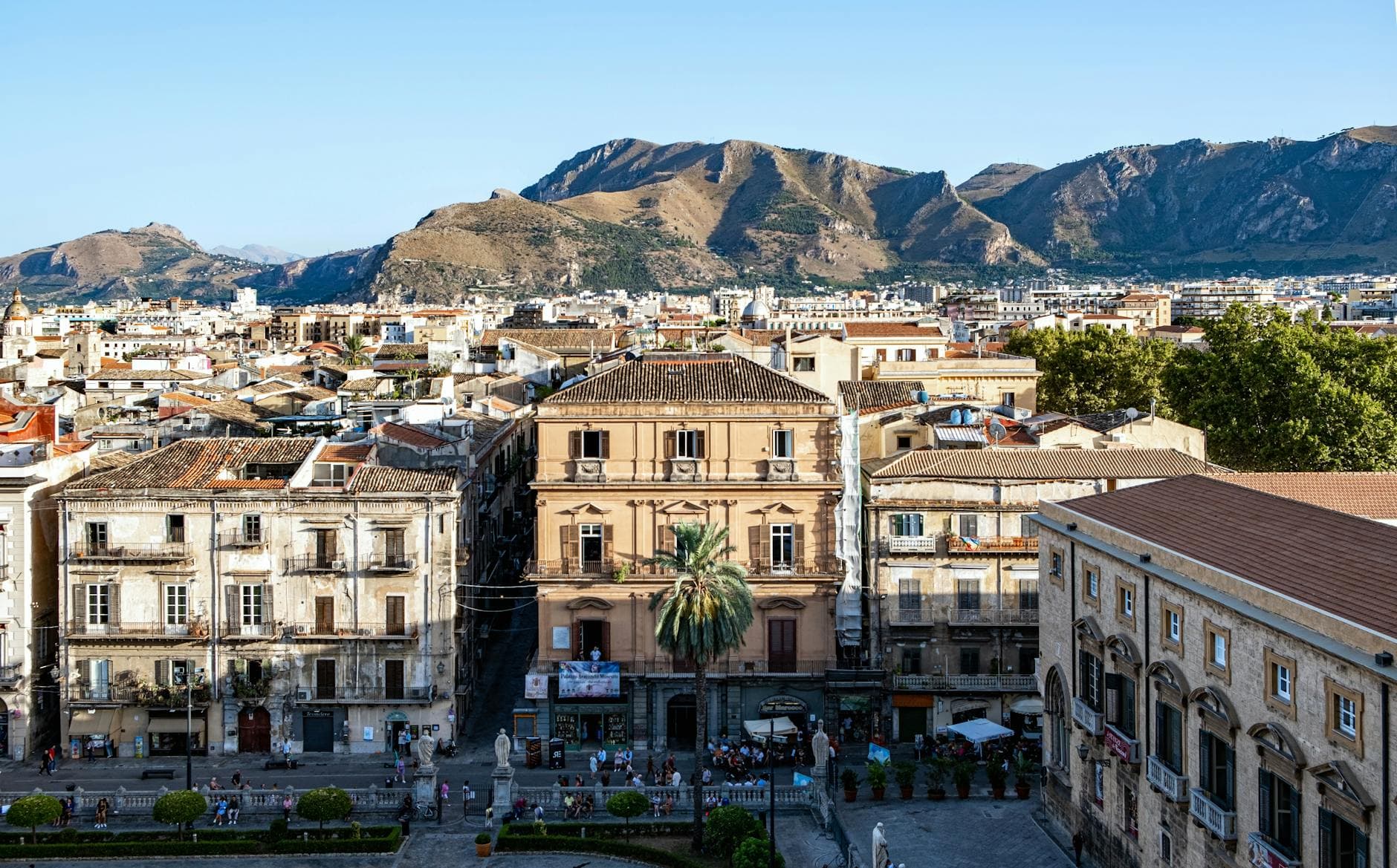Stunning view of Palermo, Sicily with historical buildings and mountains in the background.