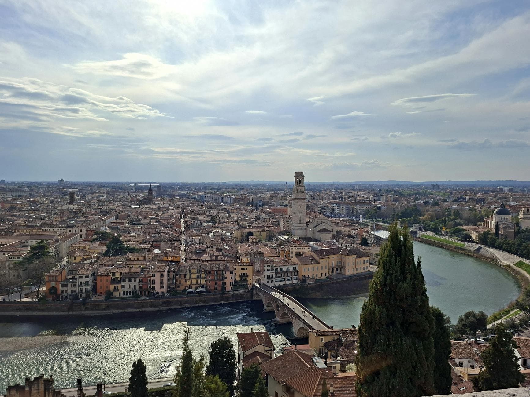 Breathtaking aerial view of Verona, Italy showcasing the Adige River and historic buildings.