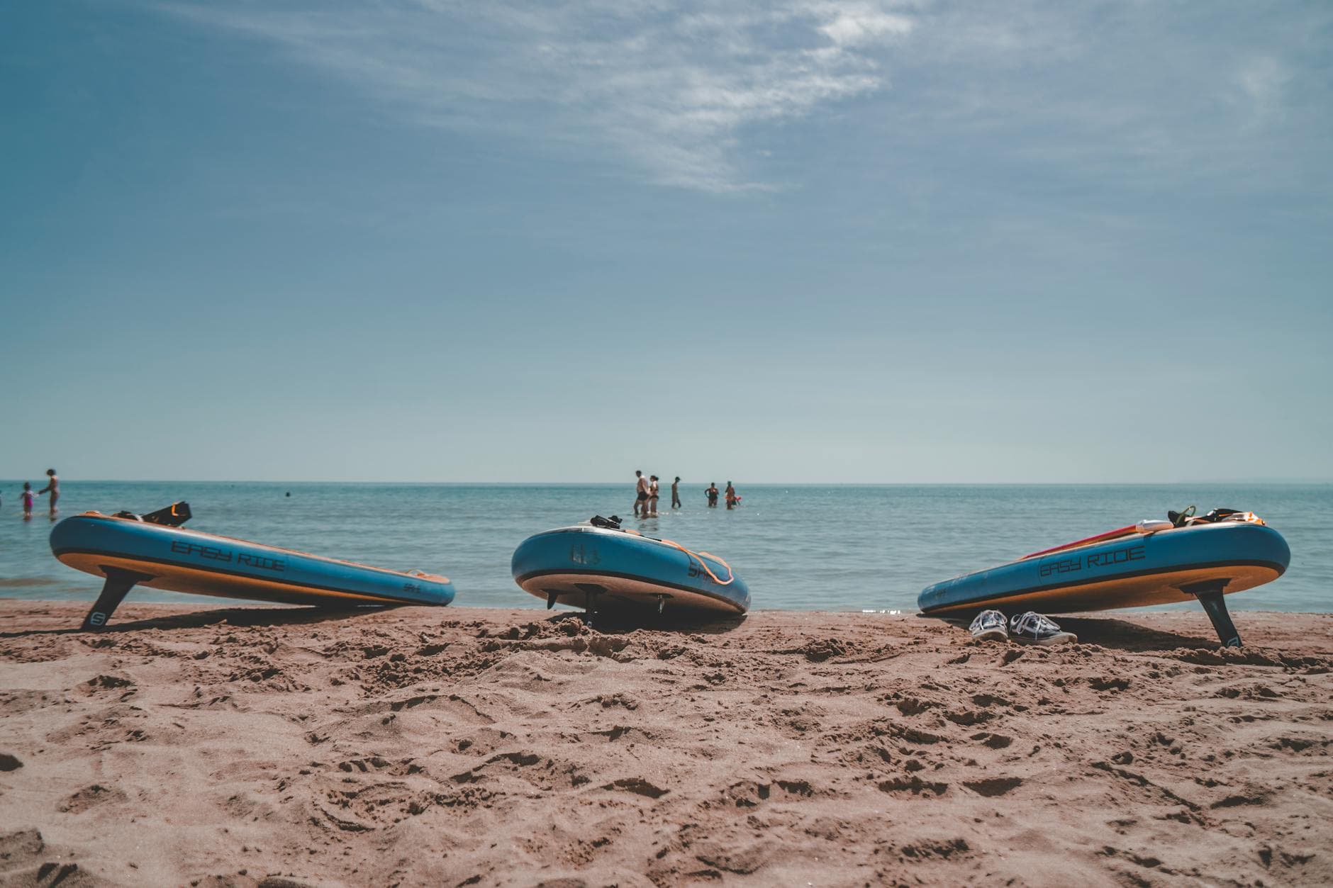 Relaxing summer day at Vasto beach with paddleboards and people enjoying the sea.