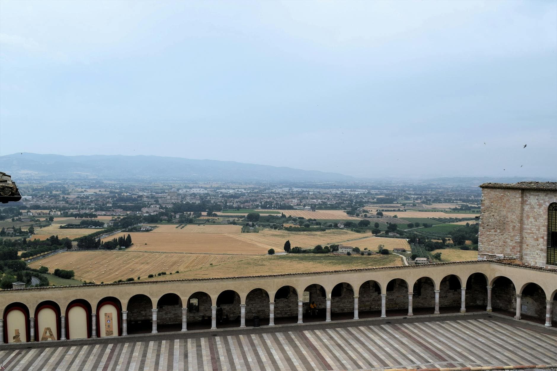 Explore the beautiful Umbrian countryside from Assisi, Italy with stunning views and historic architecture.