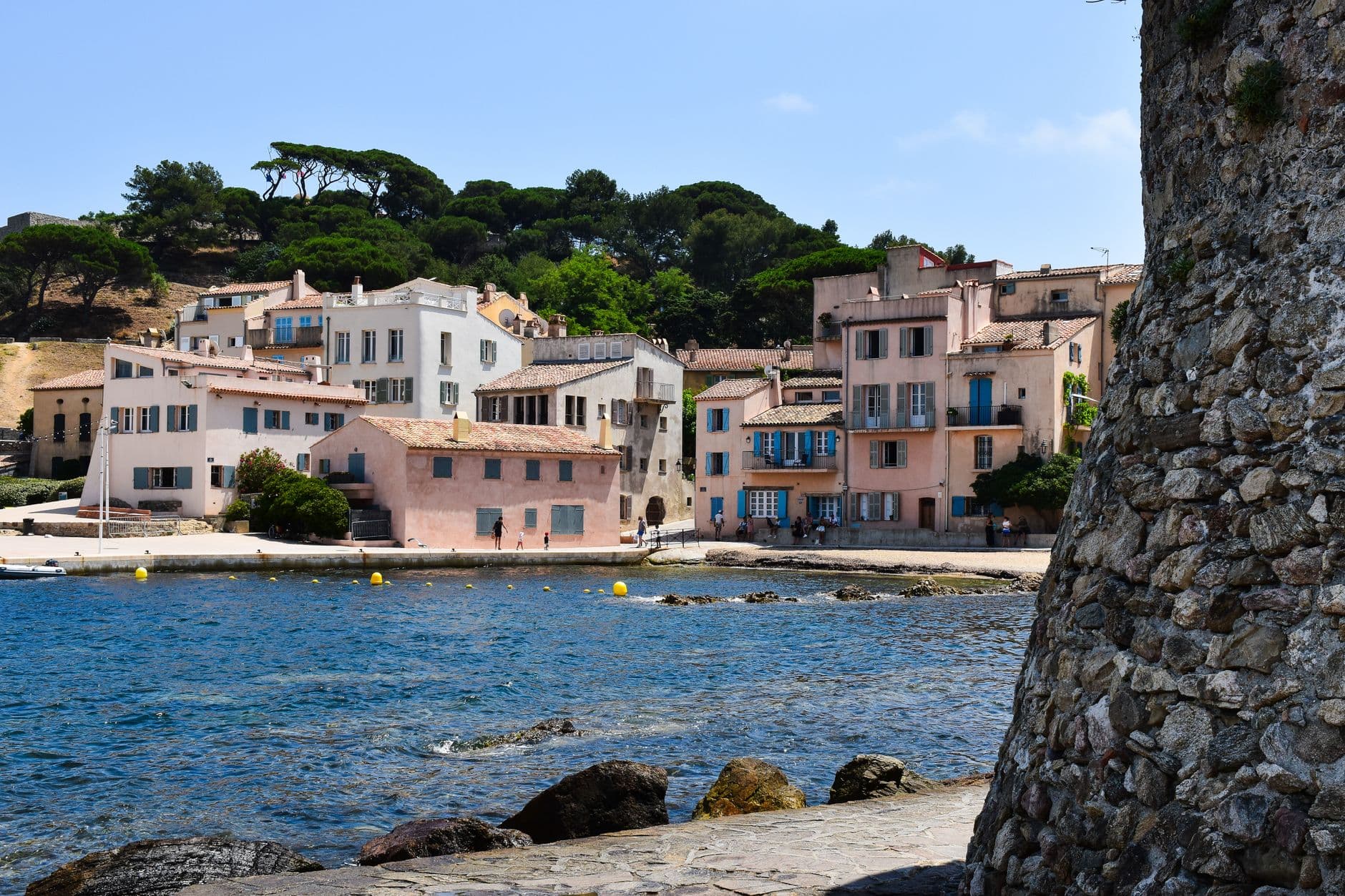 Picturesque view of colorful waterfront buildings in Saint Tropez, capturing the essence of the French Riviera.