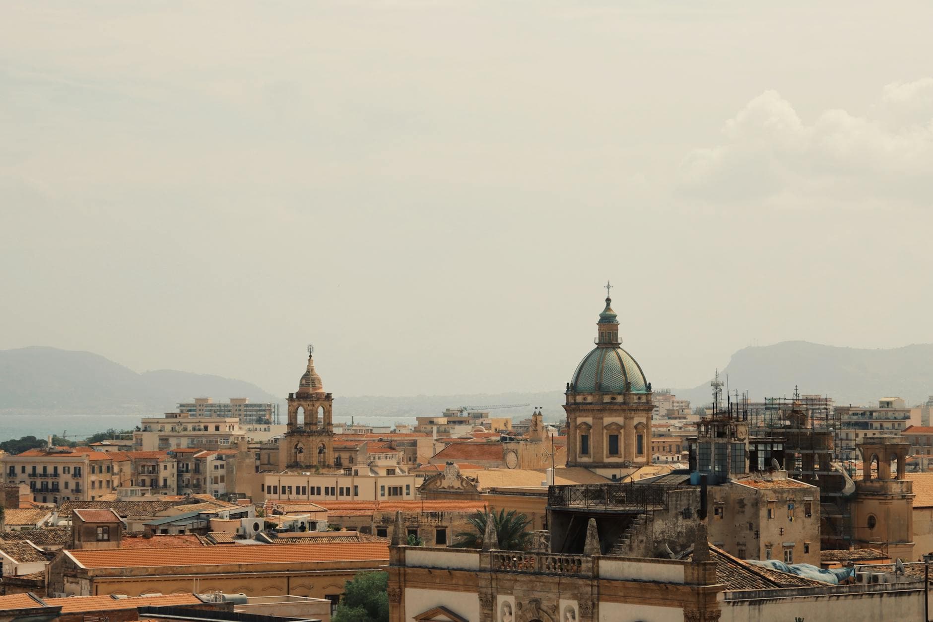 Aerial view of majestic domes amidst the vibrant cityscape of Palermo, Sicily, Italy.