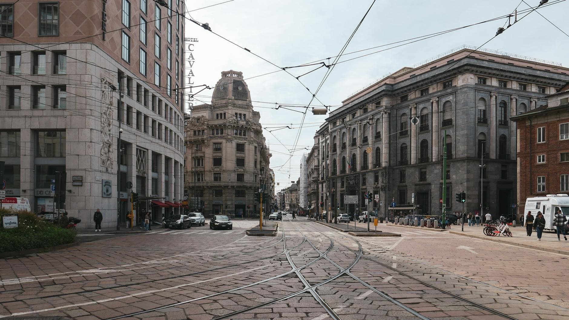 Street scene in Lombardy showcasing historic architecture and urban life.
