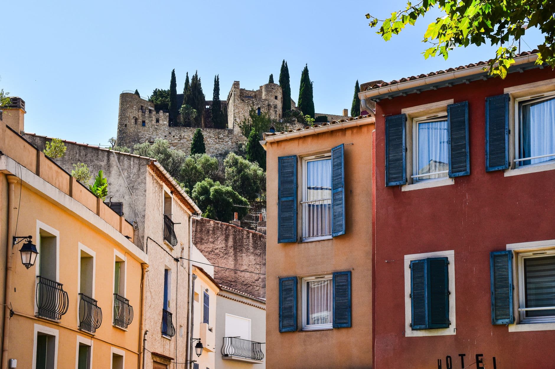 Explore the vibrant architecture and historic castle of Cassis, Provence, France.