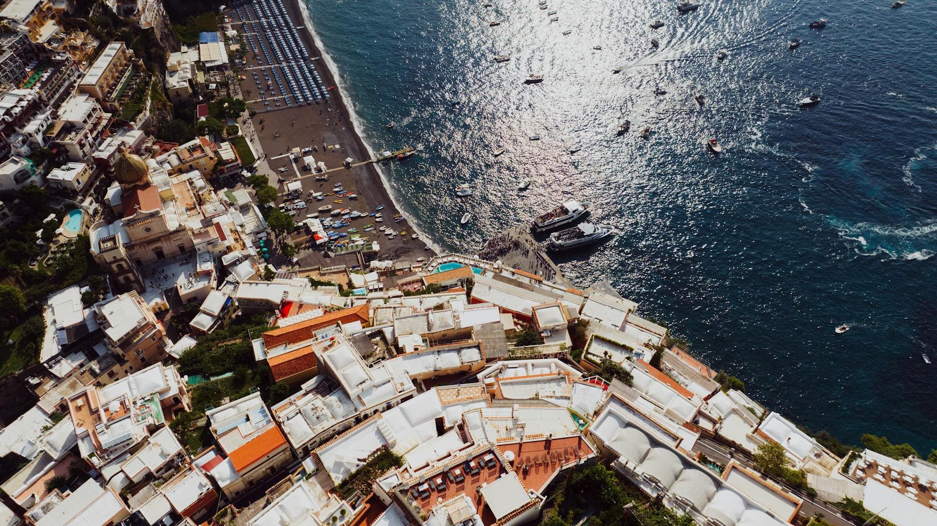 A breathtaking aerial view of Positano, Italy showcasing vibrant architecture and serene sea.
