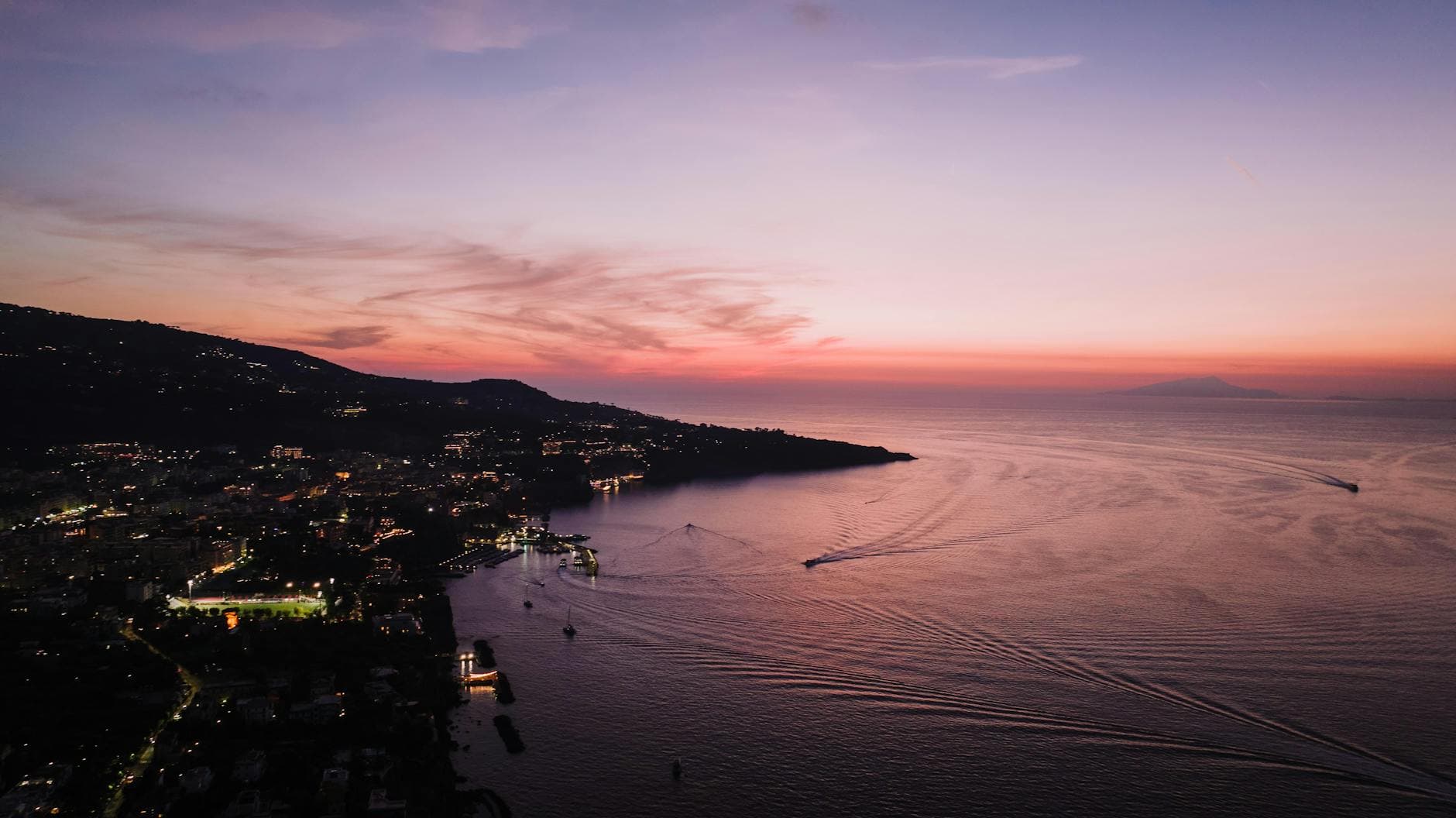 Breathtaking aerial view of Sant'Agnello coastline during sunset in Italy.