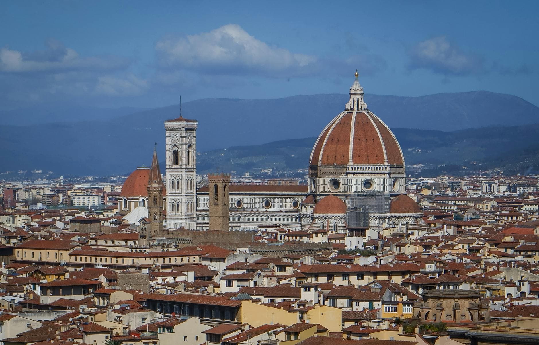 Stunning aerial view of Florence with the iconic Florence Cathedral and historical cityscape.
