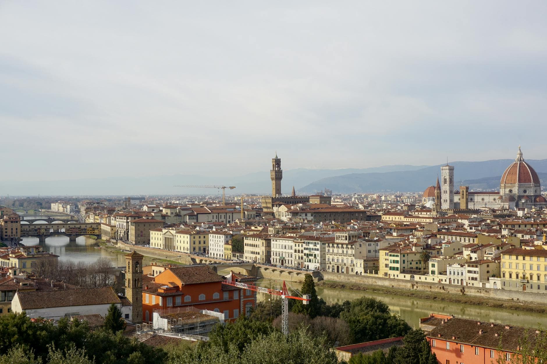 Elevated view of Florence featuring Ponte Vecchio and Cathedral of Santa Maria del Fiore.