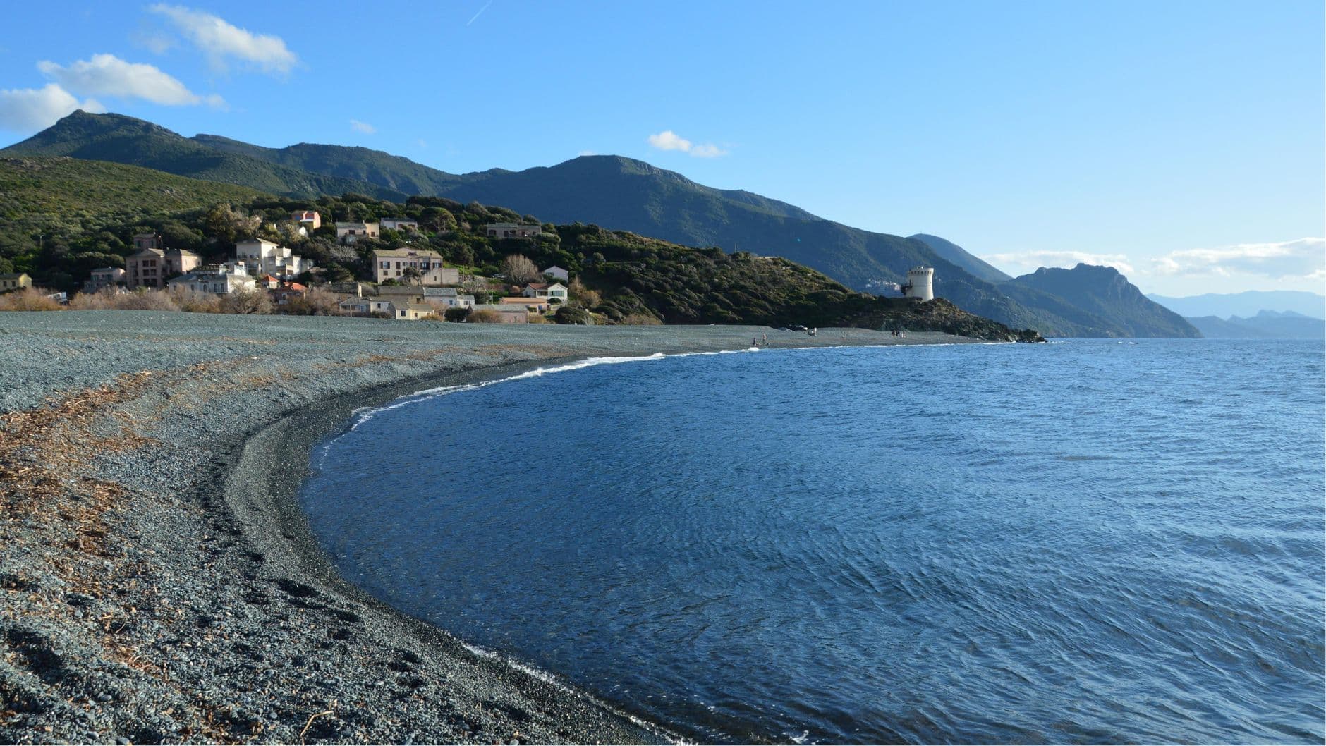 Beautiful coastal view of Ogliastro village and the Mediterranean Sea in Corsica, France.