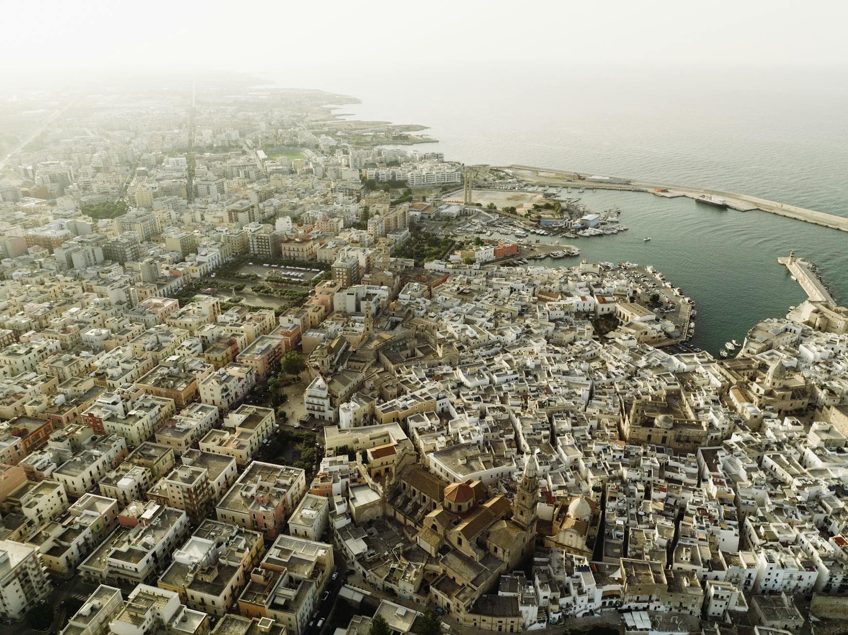 Stunning aerial view of Monopoli, Apulia, showcasing its coastal beauty and historic architecture along the Adriatic Sea.