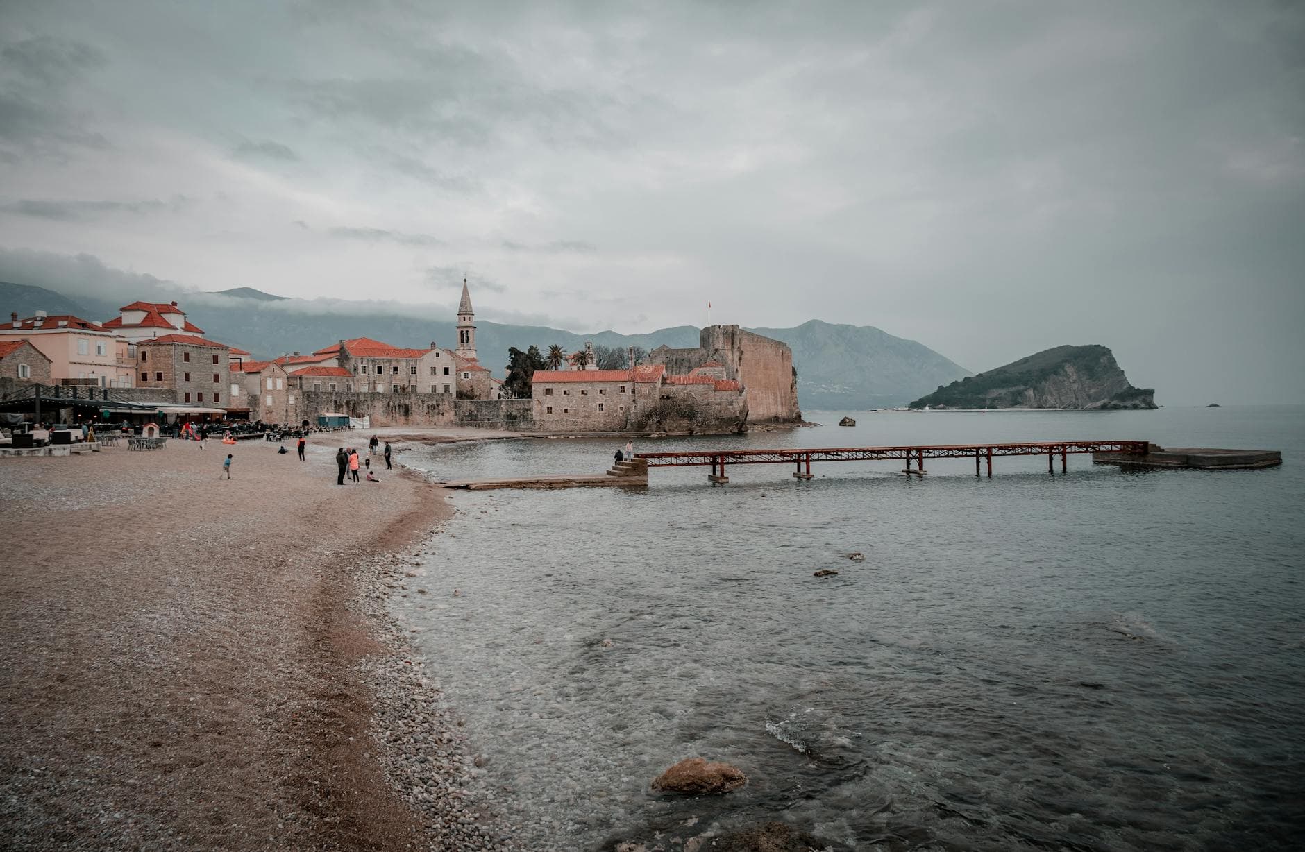 Stunning coastal view of Budva's Old Town beside the Adriatic Sea in Montenegro.