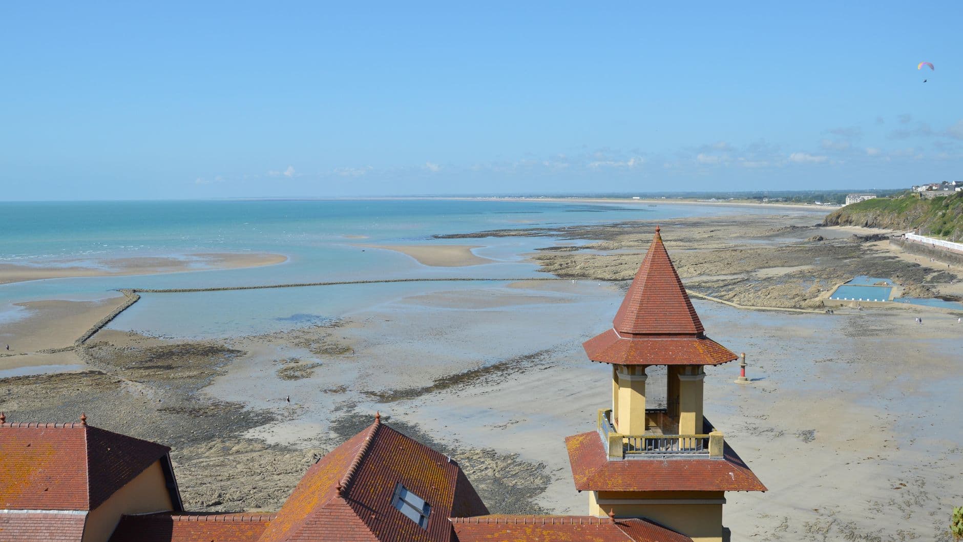 A stunning aerial view of the beach in Granville, Normandie, France with a captivating coastal landscape.